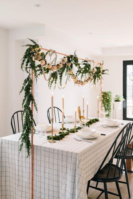 Can never get enough of this tablescape!! 

Faux juniper garland. Tablescape design. Christmas tablescape. Holiday decor. Christmas decor. Mercy glass garland. Table decor. String lights 

#LTKHoliday #LTKSeasonal #LTKhome