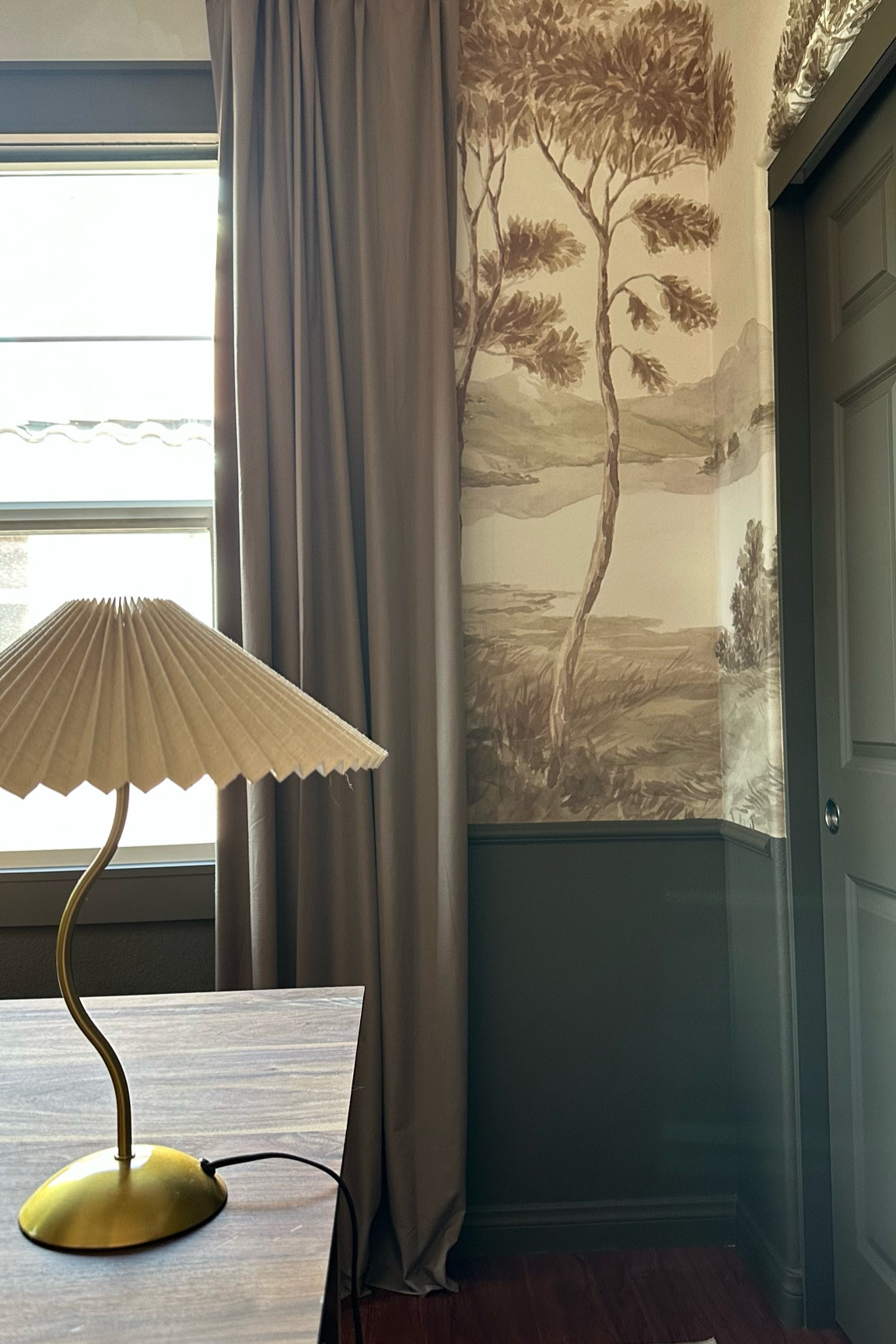 Brown wallpaper and paint home office, brown curtains, landscape mural, wavy desk affordable desk lamp, scenic wallpaper, brown paint, chair rail ideas

#LTKHome