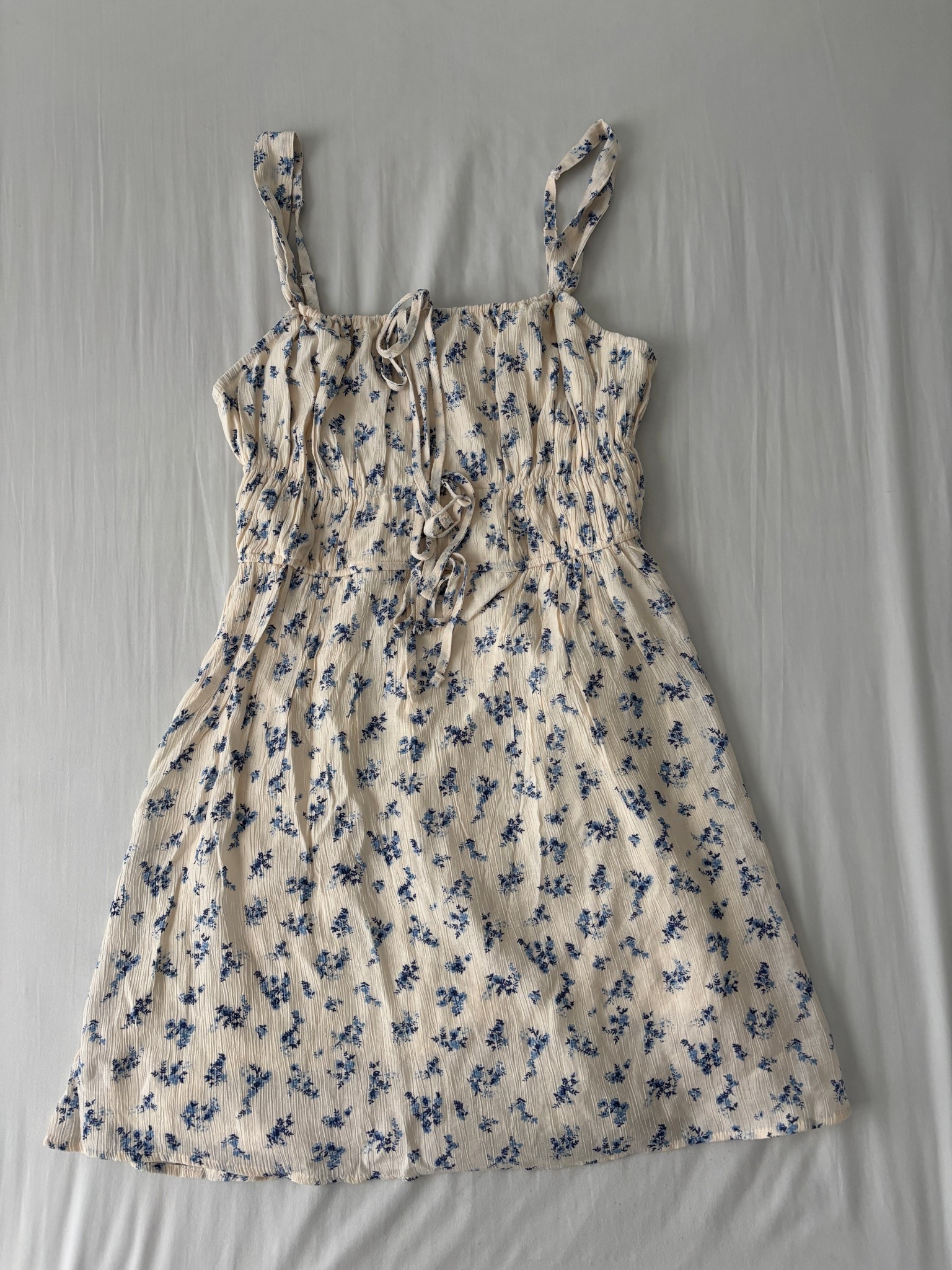 Short floral front tie dress. A summer staple! 🫐🤍

#LTKFindsUnder50 #LTKStyleTip #LTKSeasonal