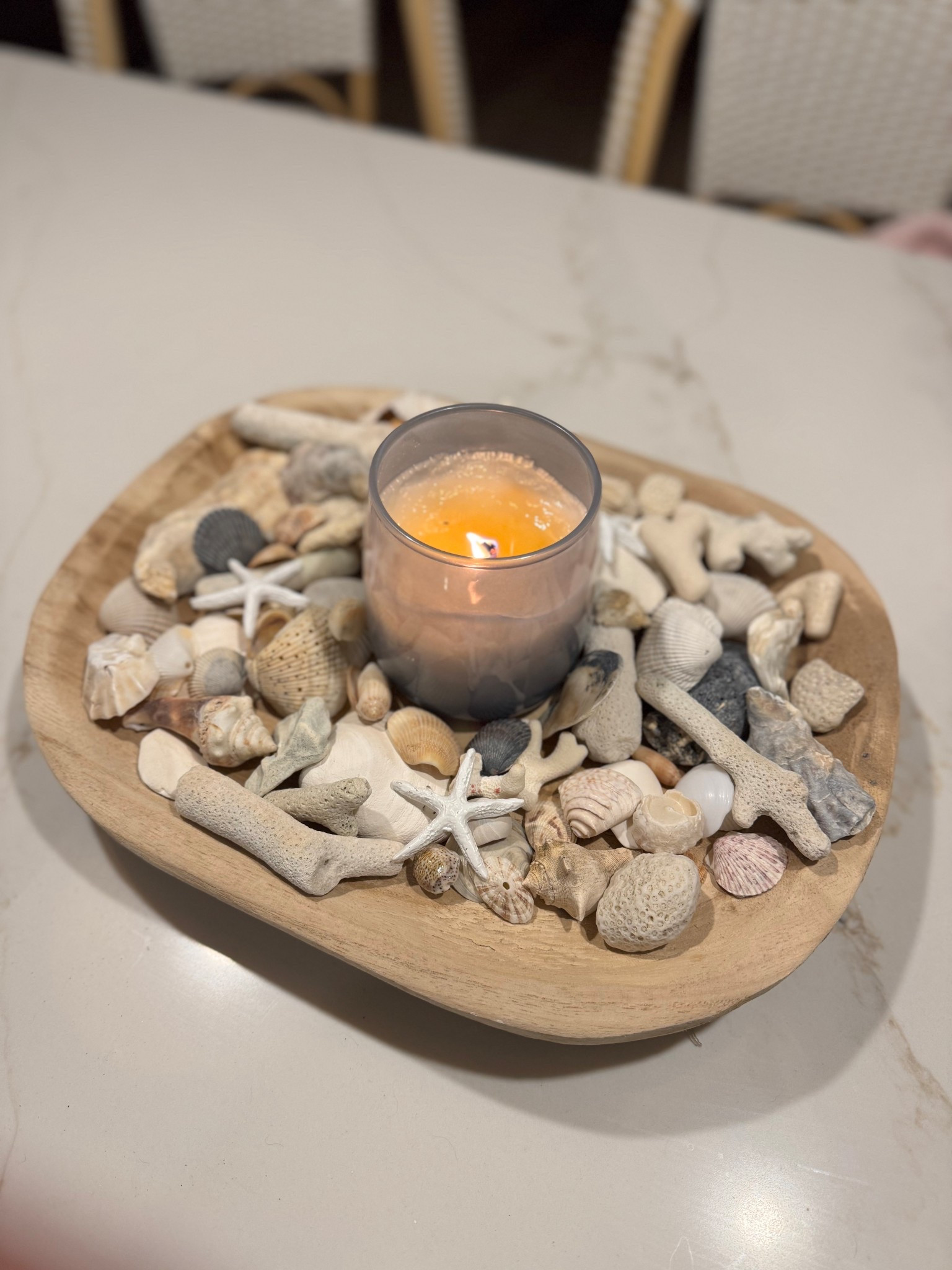 Decorative coastal centerpiece with candle with shells collected from different beaches 

#LTKSaleAlert #LTKvlog #LTKHome