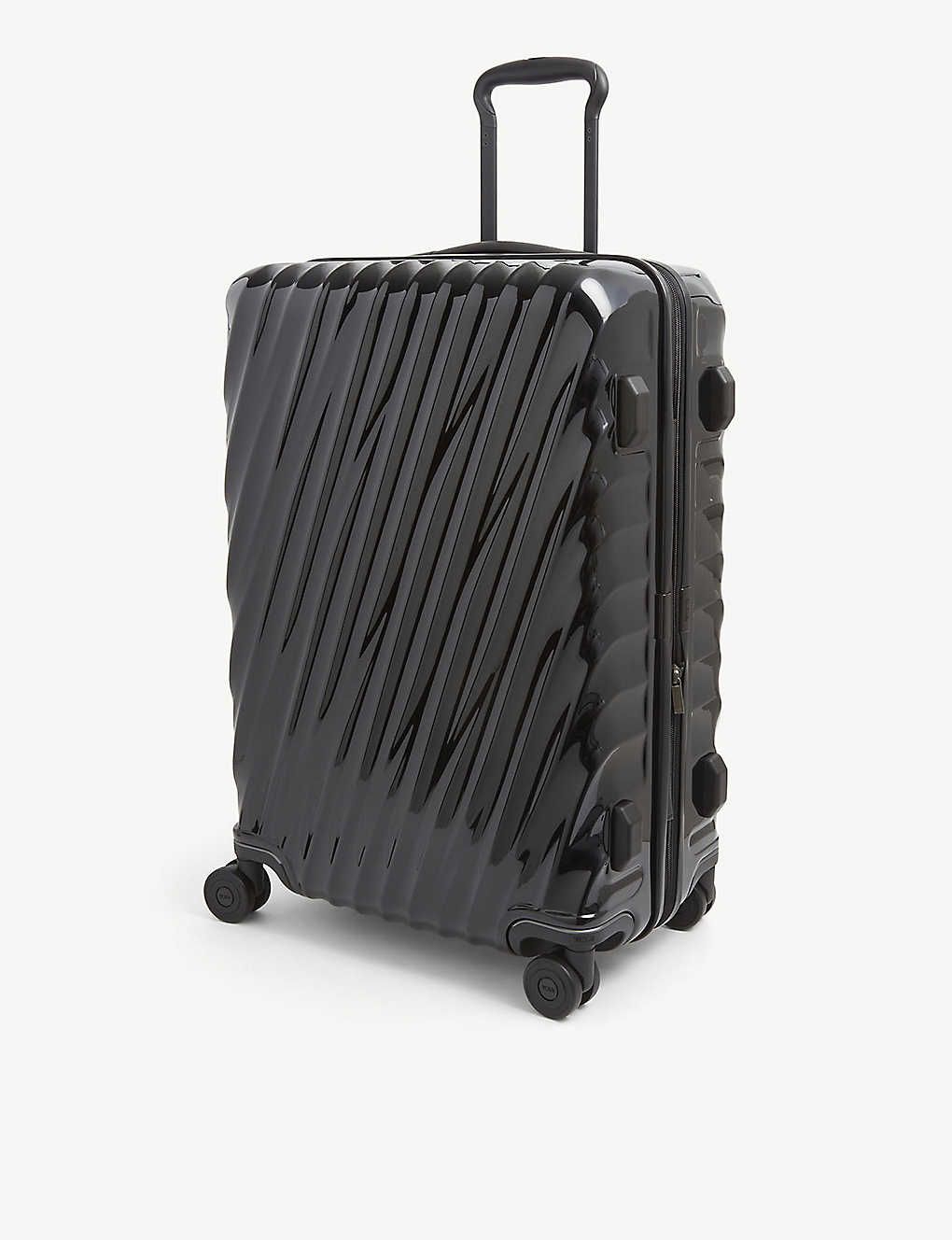 International Expandable 19 Degree large polycarbonate suitcase | Selfridges