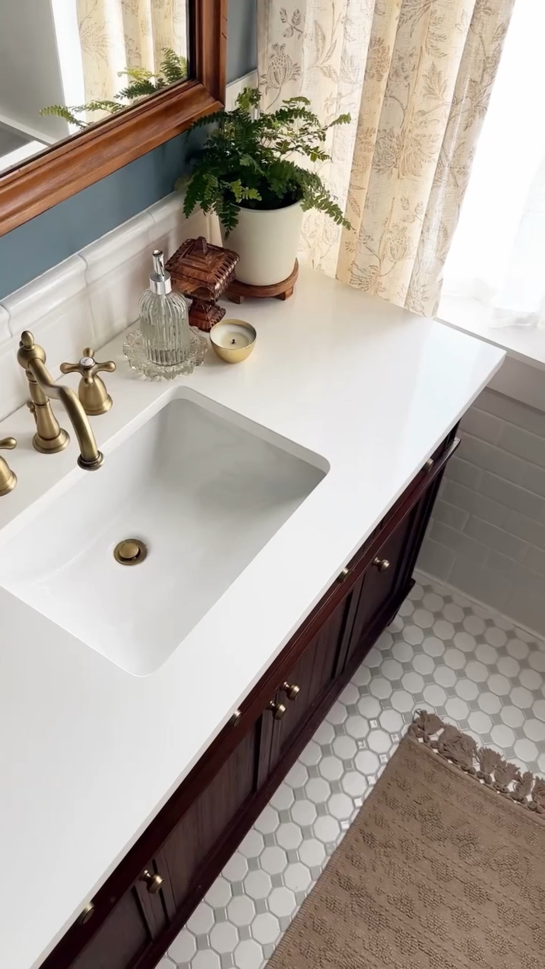 I still can’t believe it’s real 🥹

Yes, our bathroom renovation has been in the works for TWO YEARS 🫣 but it’s officially DONE!! And boy has it been magical to get to shower in such a beautiful space. It’s truly everything I imagined it could be when we first dreamed up this project. 

Will be sharing more on the full process soon, but I just couldn’t wait any longer to share with you guys!!

Vanity and faucets @signaturehw 
Light fixture, hooks, and hardware @anthropologiehome 
Gallery wall @desenio 
Wall color is “Norwegian Blue” by @behrpaint 

#bathroomrenovation #oldhouselove #bathrooms #bathremodel #vintagehome #historichouse