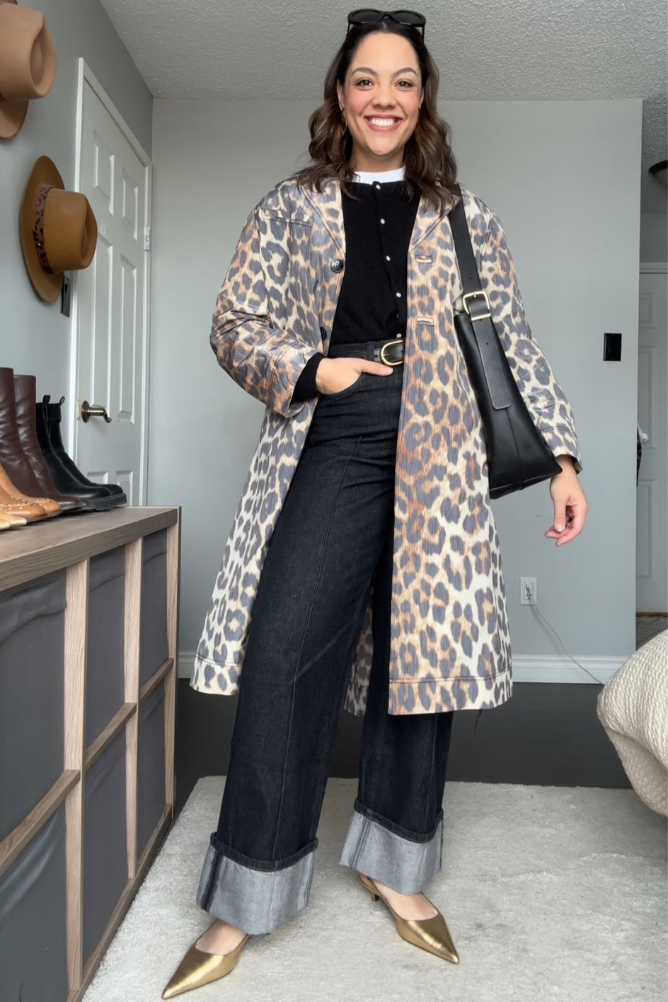 Styling a leopard print trench coat! Details below:
-Ganni leopard print trench coat. I have a size 40. 
-Sézane black cardigan. I have a large. 
-Whute T-shirt. 
-Black jeans with cuffed hem from Banana Republic. I have a size 29. 
-Black belt with gold buckle. 
-Madewell black leather bucket tote bag. 
-Celine Triomphe sunglasses. #LTKMostLoved 

#LTKSeasonal #LTKstyletip