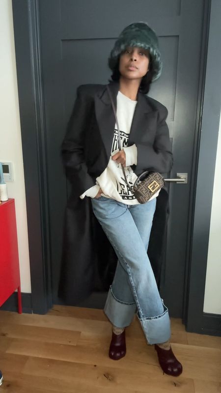 Hat is from Kith women’s
Coat from inthe808.com 
Bag @fendi