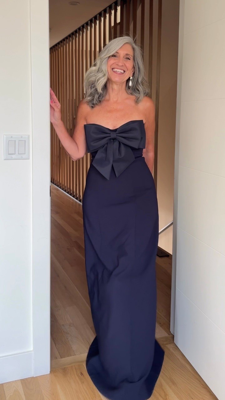 💙 Wedding Guest Dresses (some are perfect for Mother of the Bride and Mother of the Groom!)

The sculptural front bow creates a striking focal point while the navy column silhouette holds and elongates beautifully all the way to the floor.

Save this for your next invitation. Share it with a friend who’s shopping. 💌

Sizing | 5’4½” | 135 | medium or 6

Wedding Guest Dress | Fashion over 50 | Mother of the Bride | Mother of the Groom | Black Tie | Formal Gown | Summer Wedding | Tummy Flattering Dresses | Special Occasion | Strapless Gown

#LTKSeasonal #LTKOver40 #LTKWedding
