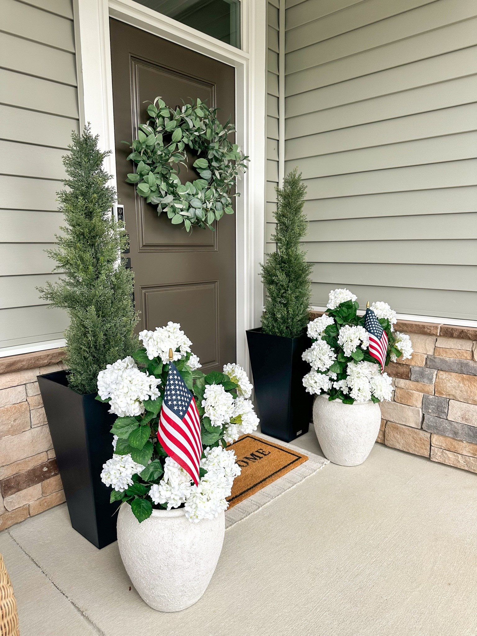 Americana summer front porch. Classic and festive. 
#frontporchdecor #americanasummer #july4th

#LTKHome #LTKSeasonal #LTKSaleAlert