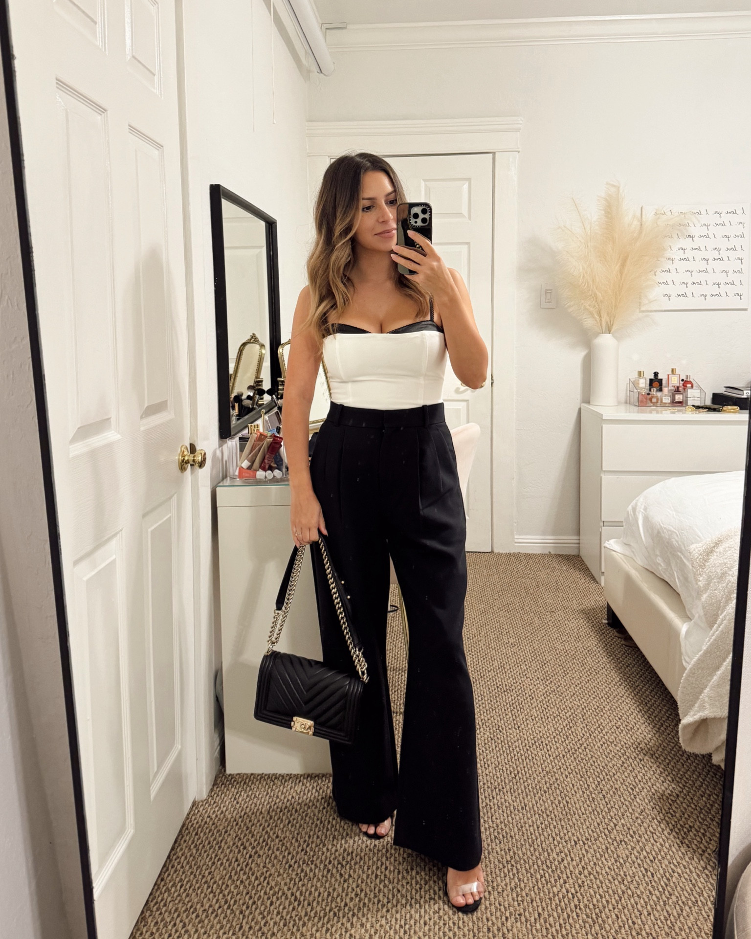 Date night outfit. I wore this white and black corset top from reformation with black tailored pants from Abercrombie and finished it off with my favorite heels that are so comfortable!

Top- 6
Pants- 26 short
Schutz clear heels
Chanel boy bag

Petite, date night outfit, Valentine’s Day outfit, trousers, corset top, bustier top

#LTKSeasonal #LTKsalealert #LTKstyletip