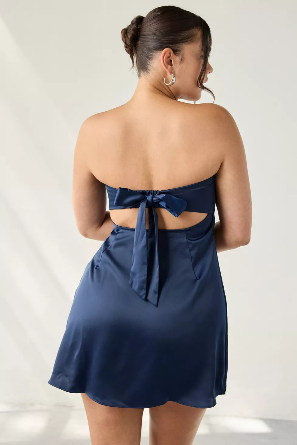 UO Mira Strapless Tie-Back Bow Satin Slip Mini Dress | Urban Outfitters (US and RoW)