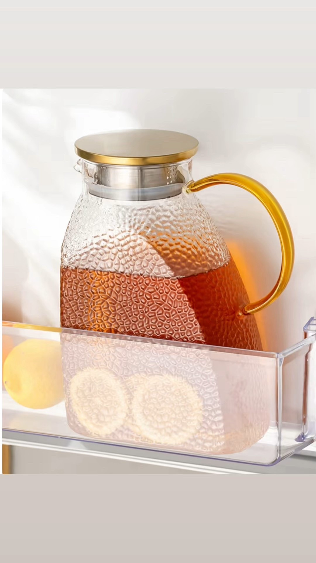 This hammered glass pitcher is giving elevated everyday luxury. Perfect for iced tea, lemon water, sangria or even hot coffee, and it fits right in the fridge door. The gold lid and handle make it feel so chic on a counter or brunch table.

High borosilicate glass means it handles heat and cold like a pro, and the built in strainer keeps fruit and tea perfectly filtered

#LTKHome #LTKfoodie