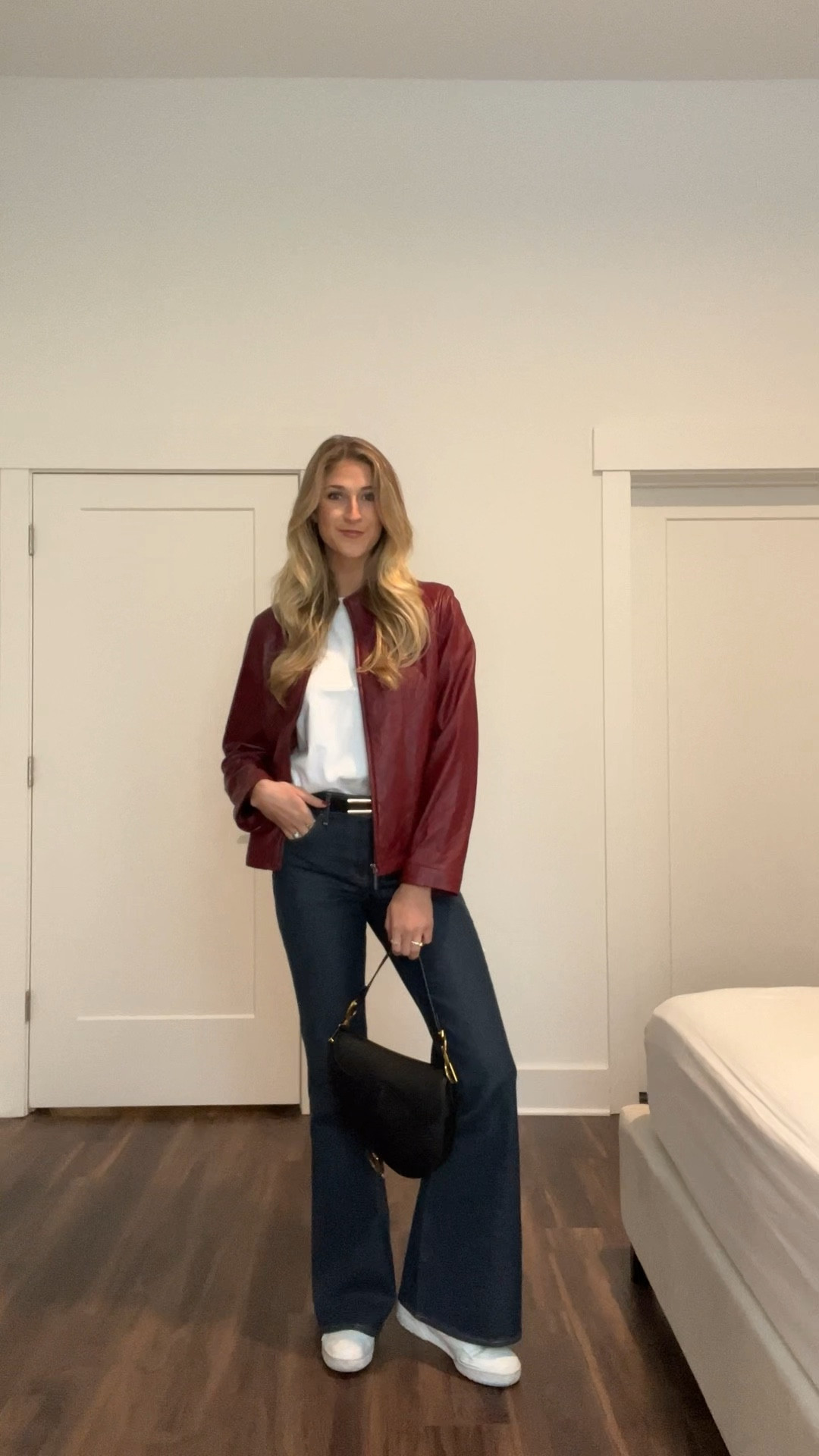 burgundy leather jacket, perfect white basic tee, dark denim flare jeans, black saddle bag, casual tennis shoes, fashion, lifestyle, new balance, 550

#LTKshoecrush #LTKstyletip #LTKbeauty