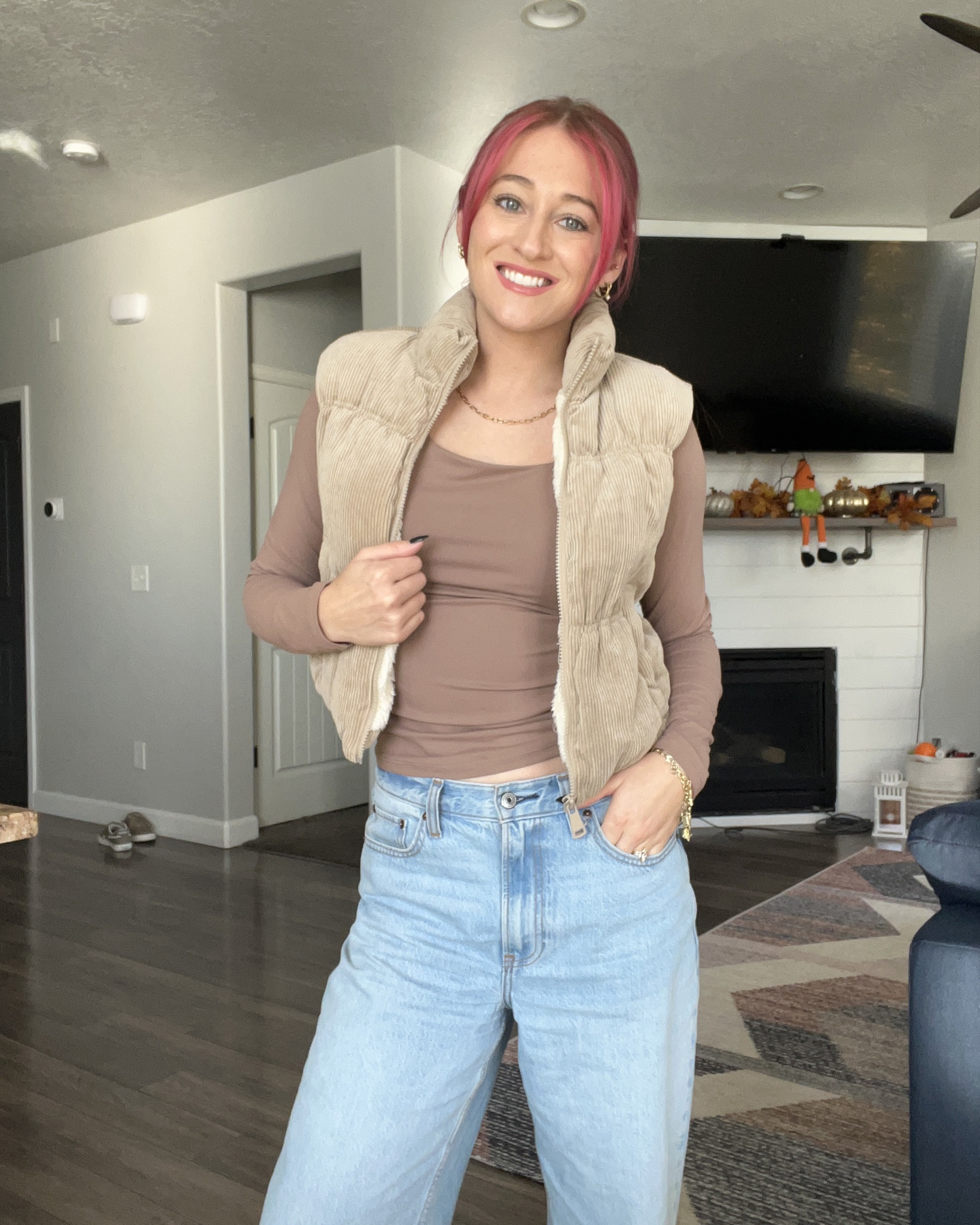 Vest isn’t exact link but the jeans & long sleeve are! 