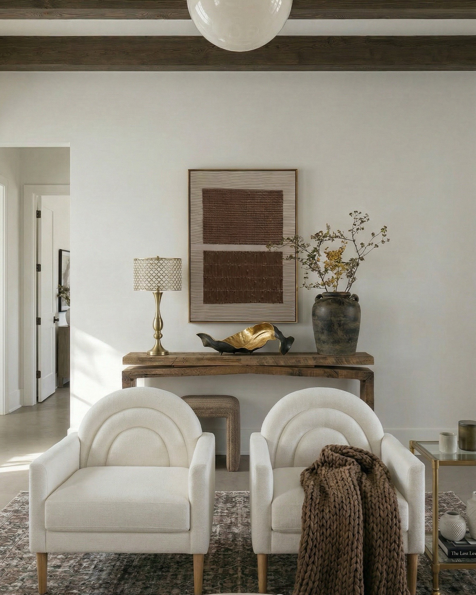 Shop the look:
• Cream upholstered sofa / neutral fabric couch • Ivory boucle accent chairs • Round light wood coffee table • Textured boucle ottomans / foot stools • Vintage distressed area rug (neutral patterned rug) • Marble slab fireplace wall / stone fireplace design • Custom built-in shelving / wood built-ins • Decorative vases (ceramic + sculptural decor) • Coffee table books + tray styling decor • Wood console table (rustic entryway table) • Upholstered bench / small stool • Brass table lamp with patterned shade • Glass + brass side table • Framed abstract wall art (neutral artwork) • Wall sconces with globe lighting • Olive branch stems / faux greenery • Woven throw blanket / textured throw • Decorative beads / bowl accents

#LTKhome #LTKsale #LTKstyletip