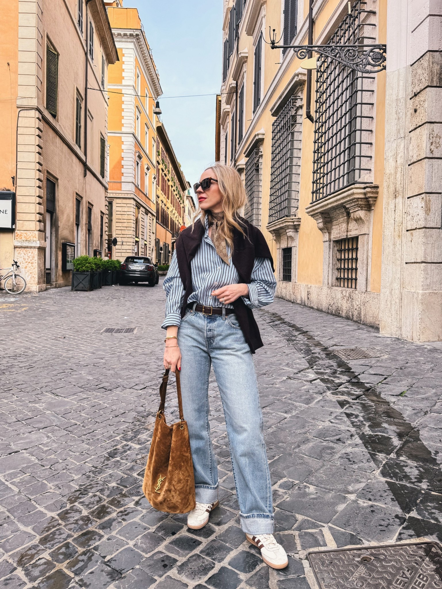 Travel outfit, European vacation, @Zara striped button down shirt, @levi baggy 90’s jeans, suede bucket bag, spring outfits 2026

#LTKSeasonal #LTKTravel #LTKOver40