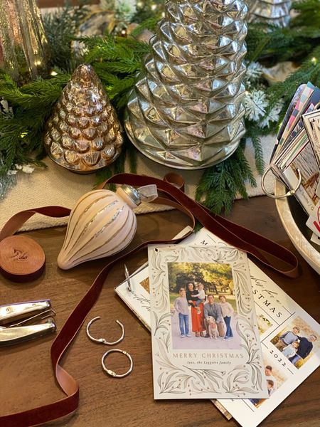 Simple Christmas decor you can keep year over year using Christmas cards you receive in the mail. At the very least, save one of your own family. Our kids love to see how much they have grown. 

#LTKfamily #LTKSeasonal #LTKHoliday