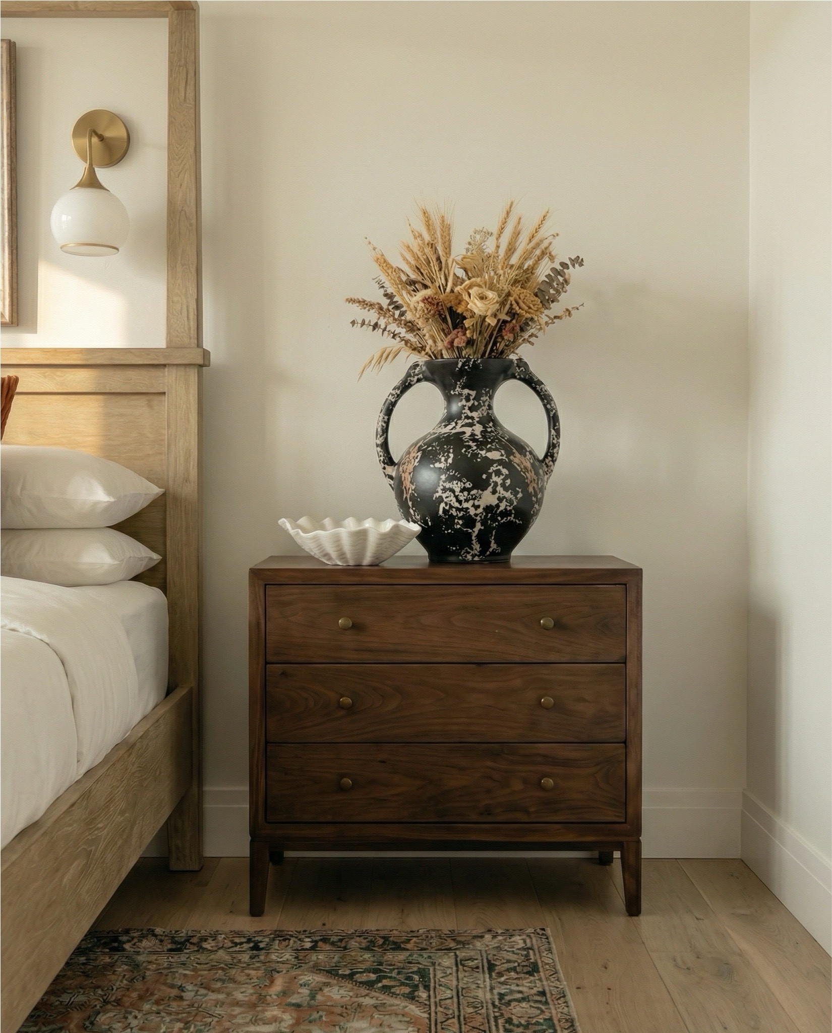 Wood canopy bed 
Brown leather upholstered bench
Brown knitted blanket
Brown throw pillows
Brown wood 3 drawer nightstands
Wall art
Glove wall lights
White tree planter
Black vase
Black table lamp
White decor bowl
Decor books
Wood dresser
Brown traditional rug 
Wood decor beads
Wood upholstered swivel chair
Wood end table
Green runner rug 
Faux olive tree 

#LTKHome #LTKSaleAlert