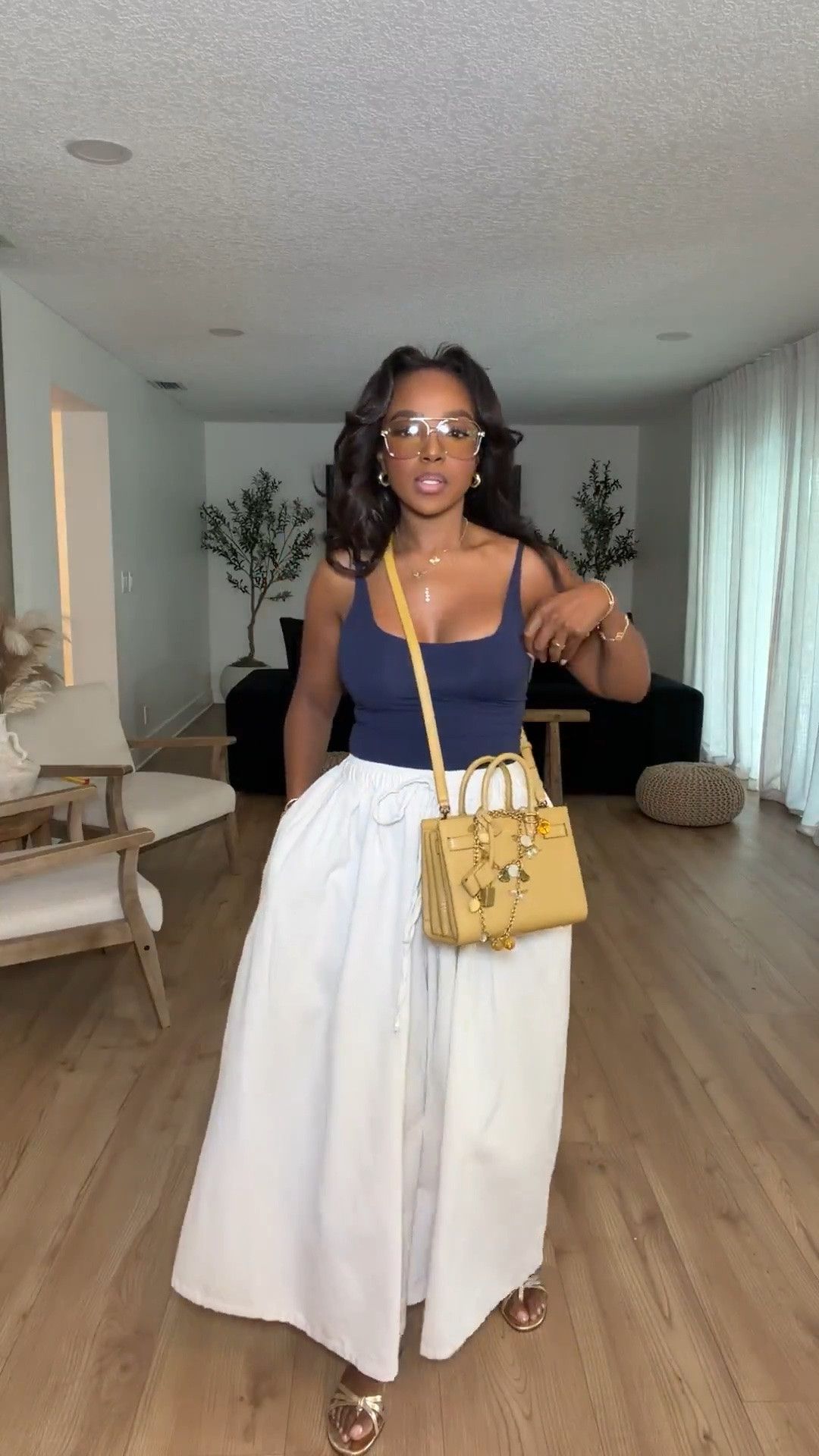 Hi Babes!

Okay this outfit is the perfect mix of polished and effortless. The navy bodysuit paired with these flowy white trousers gives that elevated rich-mom aesthetic that somehow works for everything from errands to brunch.

The bodysuit is fitted and flattering without feeling too tight, while these wide-leg pants are incredibly comfortable and create the most beautiful silhouette. Together they give that chic, put-together look without sacrificing comfort.

Where to wear this:
• Brunch with the girls
• Travel days
• Casual office days
• Lunch meetings
• Weekend shopping trips

Accessories:
The camel bag ties everything together perfectly and adds that classic designer-inspired touch. I love this look finished with gold jewelry and oversized glasses for an effortlessly sophisticated vibe.

Everything is linked below

xx Kira | IG: KirasFashionFinds

34D - 27 - 40 • Size Small or 4

#LTKgrwm #LTKootd #LTKPetite