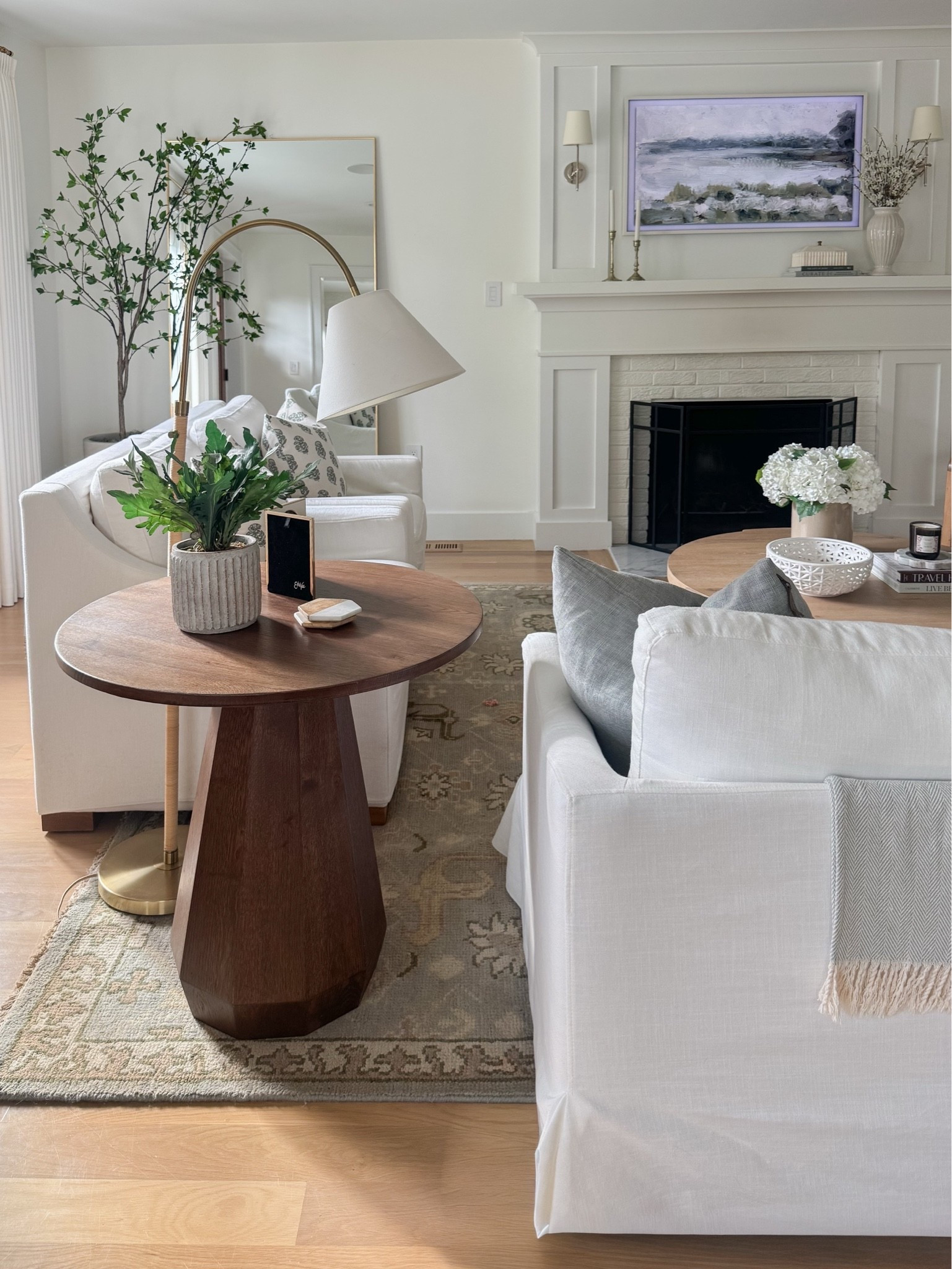 A little living room refresh with layers of texture, soft color, and timeless pieces. 🤍 This 100% wool rug from Quince brings in the prettiest muted blues, blush, greens, and ivory, grounding our affordable slipcovered sofa (that PB look for less!) and classic slipcovered chairs. An arched floor lamp and oversized walnut side table add warmth and interest — and I love that the table would be equally beautiful styled in an entryway.

A collected, cozy look with a mix of high and low. Everything linked!

#LTKSaleAlert #LTKHome #LTKdayinmylife