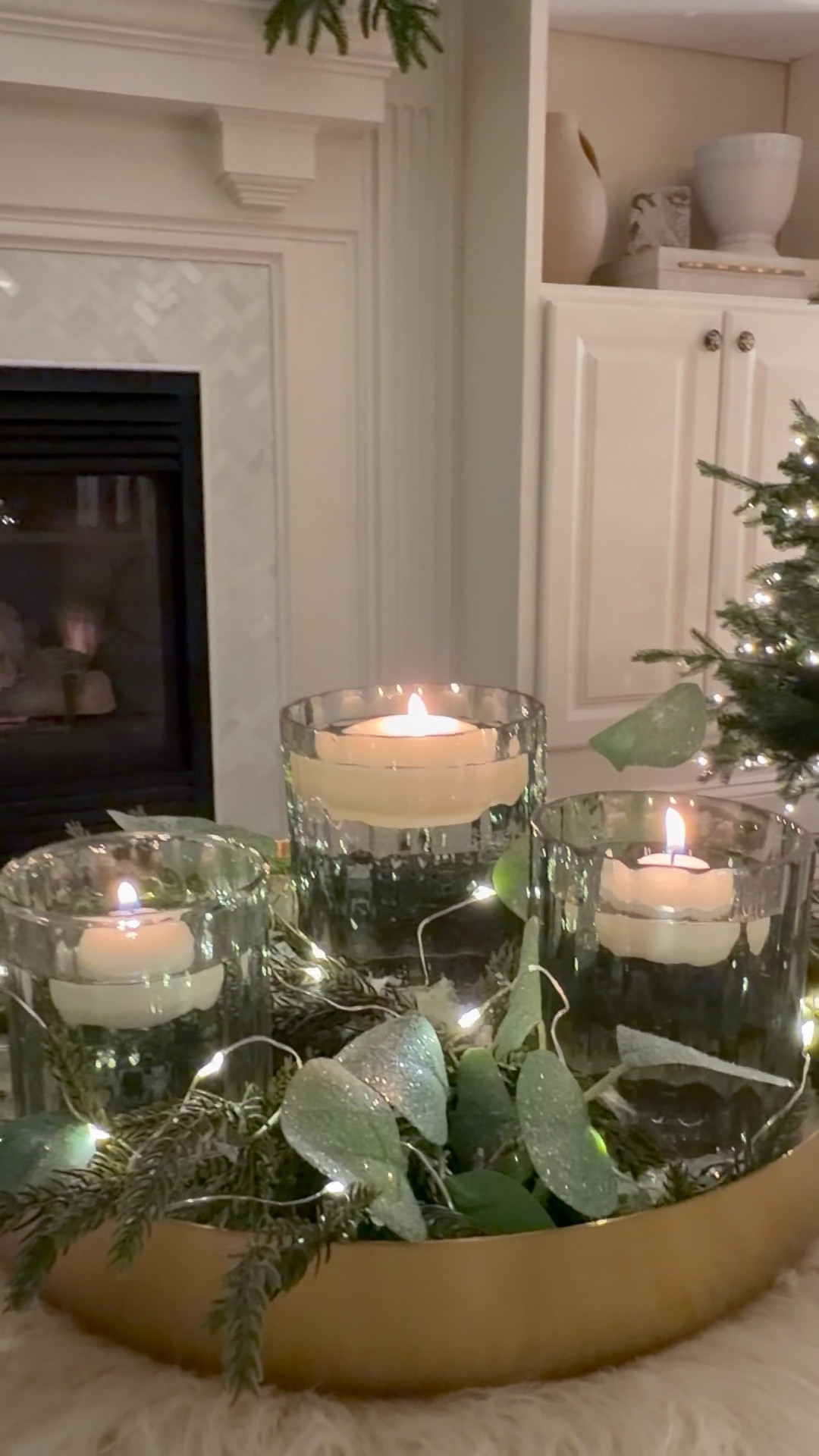 Holiday Candle Centerpiece ✨The kind of easy centerpiece that feels custom-made — but takes minutes to pull together.

Think of it like the 5-ingredient recipe of holiday decor: glass, greenery, glow, faux snow, and a golden base.
Here’s the secret — work in odd numbers (3 or 5 candles), mix textures, and vary heights for that soft, layered look.

Style it on your coffee table, dining table, or console — it’s the perfect touch for holiday gatherings and quiet nights in. That warm, cozy glow just makes the whole room feel a little more magical. ✨

Christmas Decor
Christmas Styling 
Holiday styling 
Holiday centerpiece 

#LTKSeasonal #LTKHoliday #LTKHome