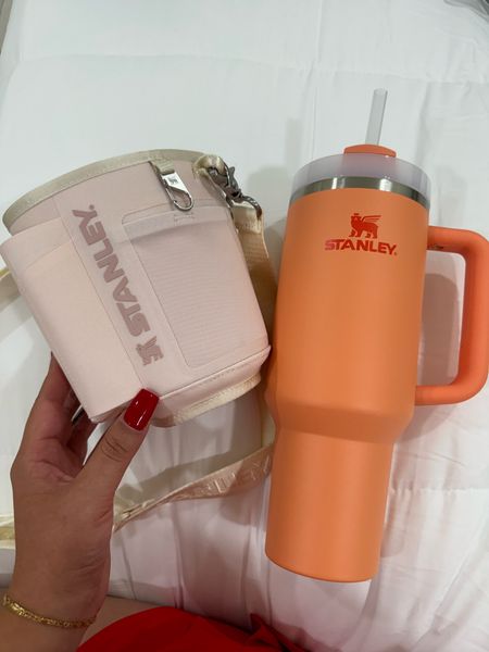 Okay this Stanley color is perfection!!!! It’s like a sherbet ice cream!!!!! So cute!!! And how genius is this little strap/storage thing you can put on it?!? You can put your cards, wallet, lip gloss, keys you name it!!! 

#LTKFindsUnder50 #LTKActive #LTKFitness