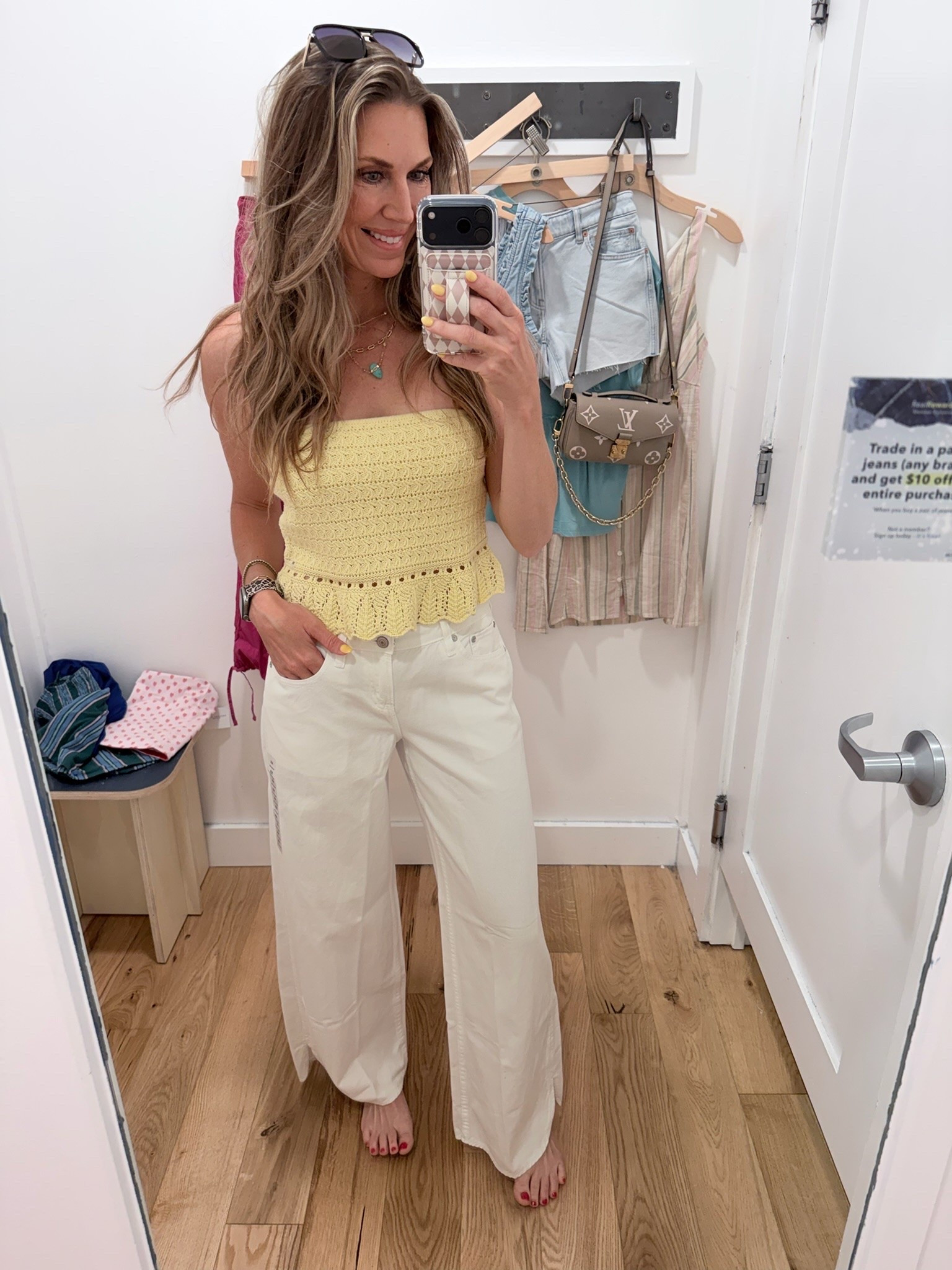 This cropped yellow lace tube top paired with these white jeans is perfection!