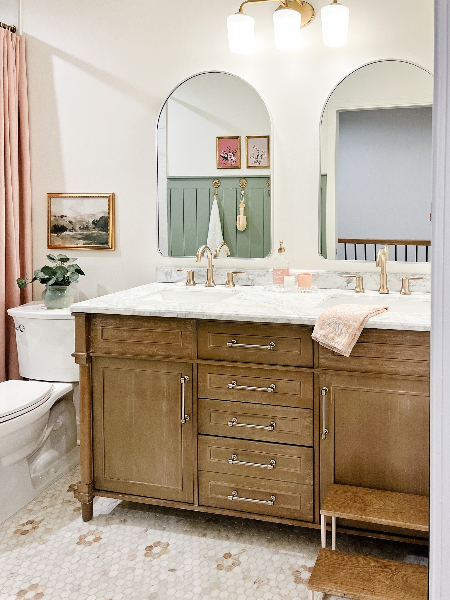 Bathroom vanity, marble countertops, delta champagne bronze faucets, nickel hardware, arched vanity mirrors, hex tile, little girls kids bathroom, pink extra long shower curtain 

#LTKFind #LTKunder50 #LTKhome