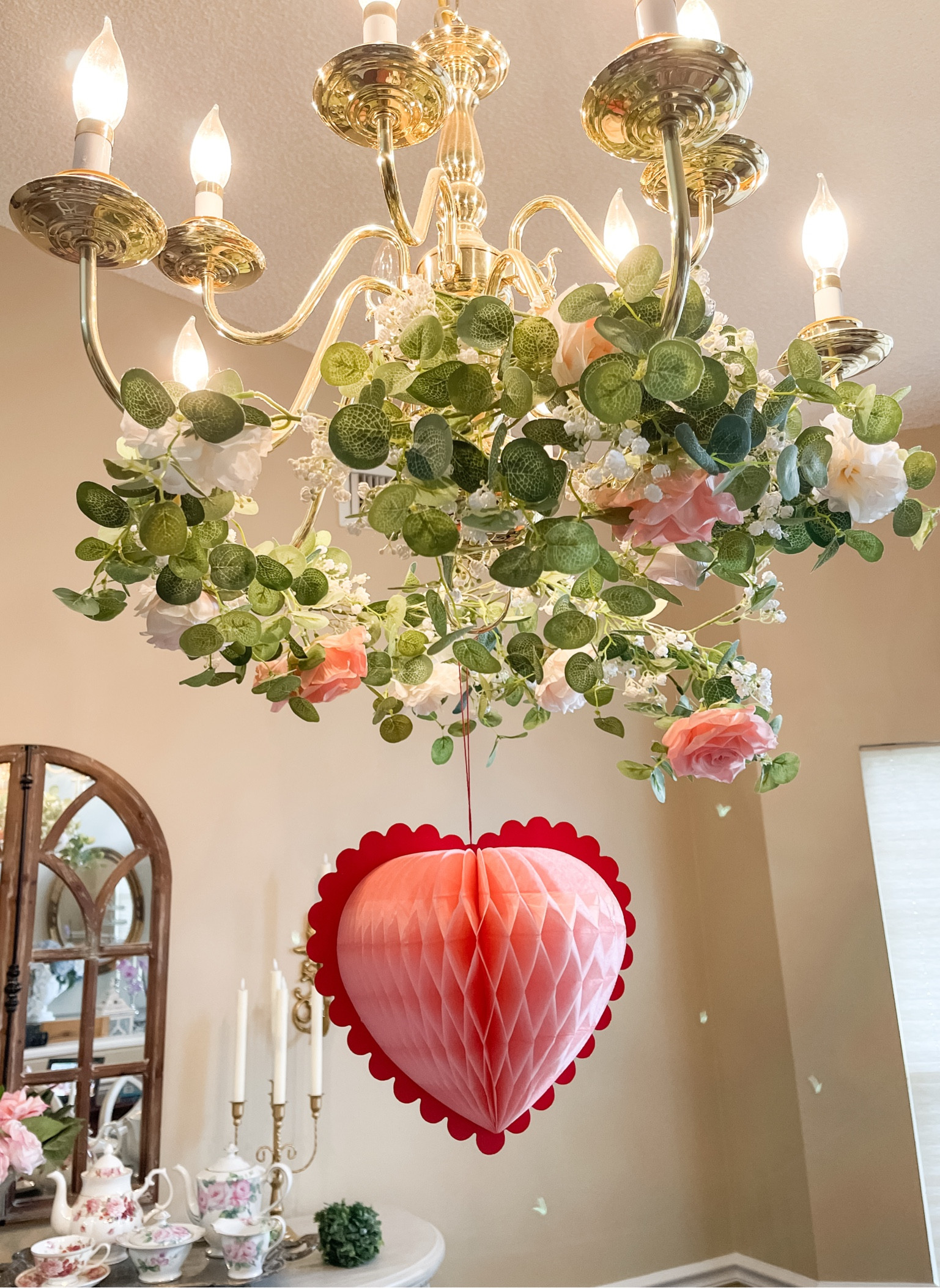 Valentine’s Day chandelier decoration

I love the look of a rose garland wrapped around a chandelier  

#LTKHome #LTKMostLoved #LTKSeasonal