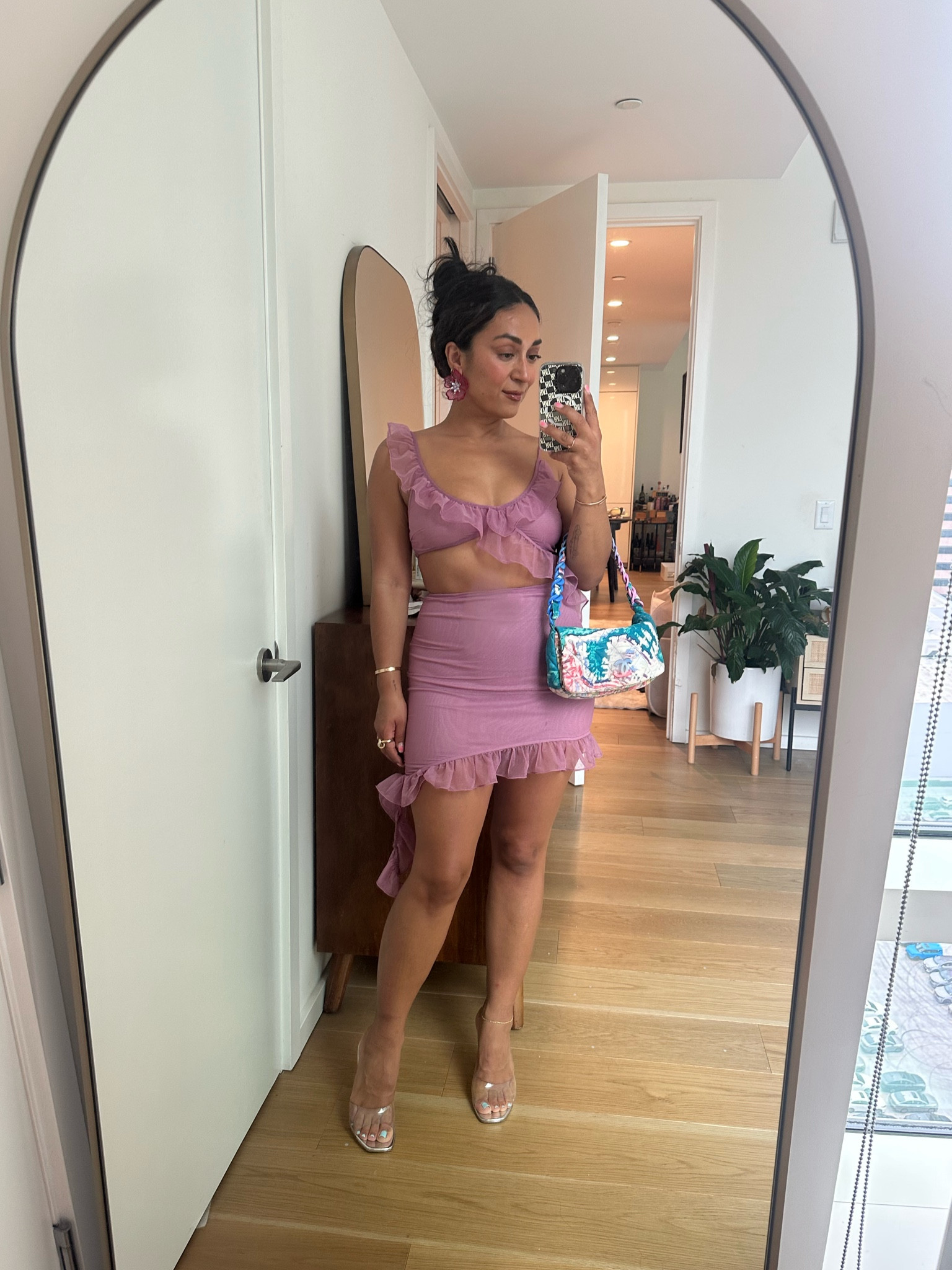 A flirty ruffle mini dress under $100 for a summer wedding in Vegas. Paired with clear Amina Muaddi Lupita heels, a vintage Chanel bag, and flower earrings. 

#LTKunder100 #LTKFind #LTKwedding