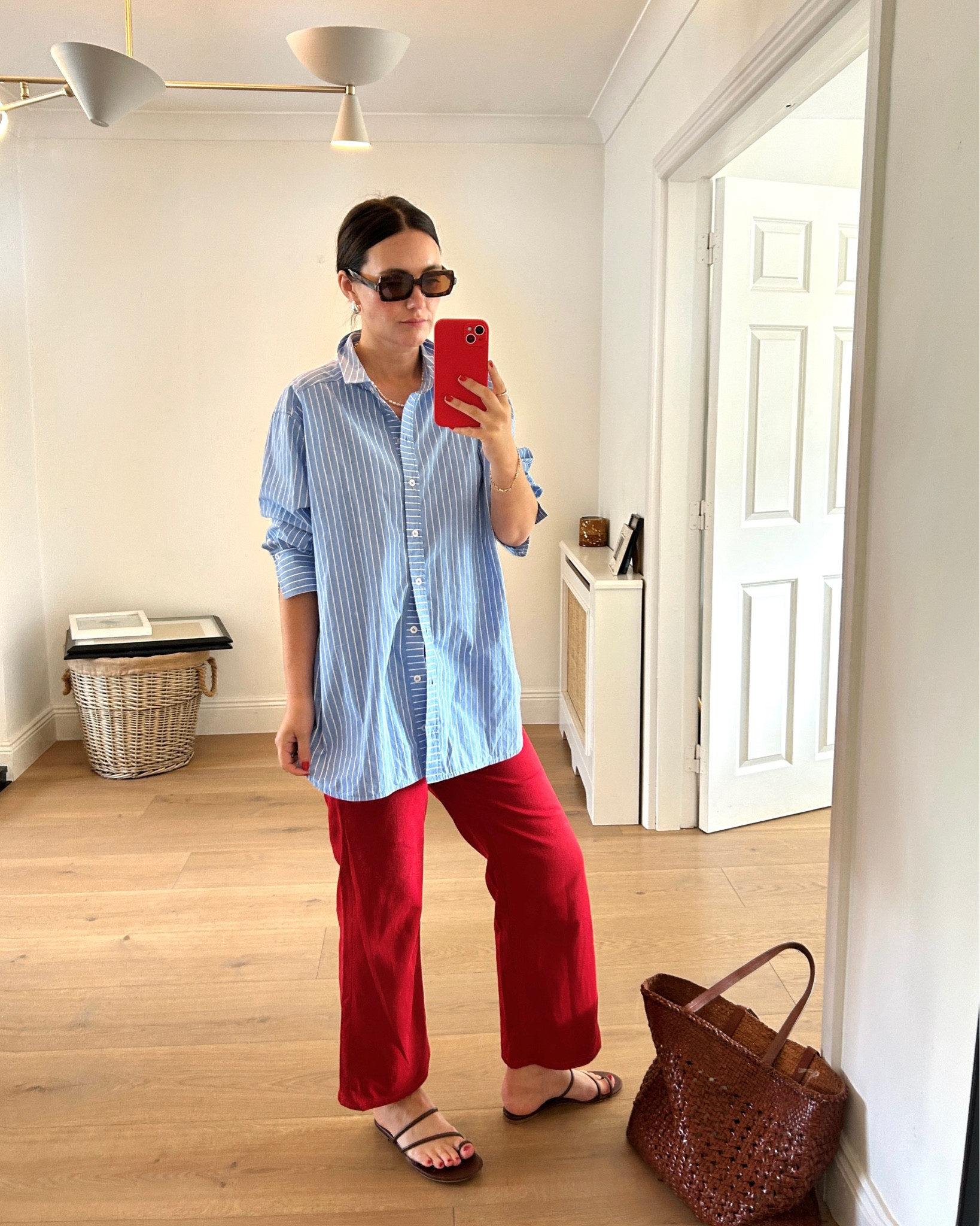 Red trousers, blue shirt, reformation sandals, sezane lovers 