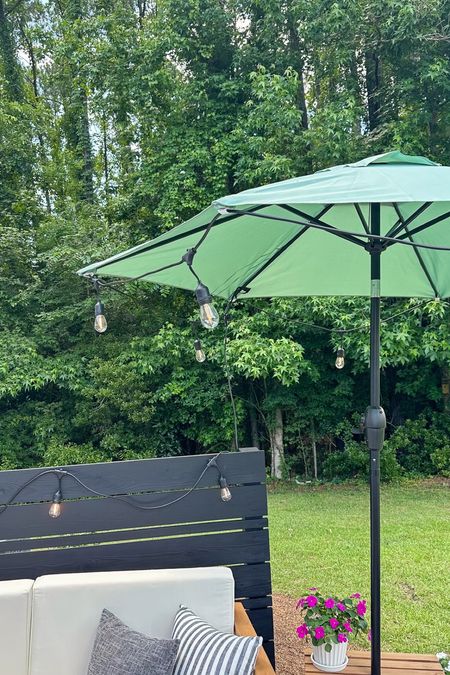 #ad Outdoor string lights, patio umbrella, and my DIY umbrella stand table from @loweshomeimprovement! #lowespartner #patioumbrella #outdoorspaces #patiofurniture #outdoorlighting #outdoordecor#LTKHome

#LTKSeasonal #LTKsalealert #LTKhome
