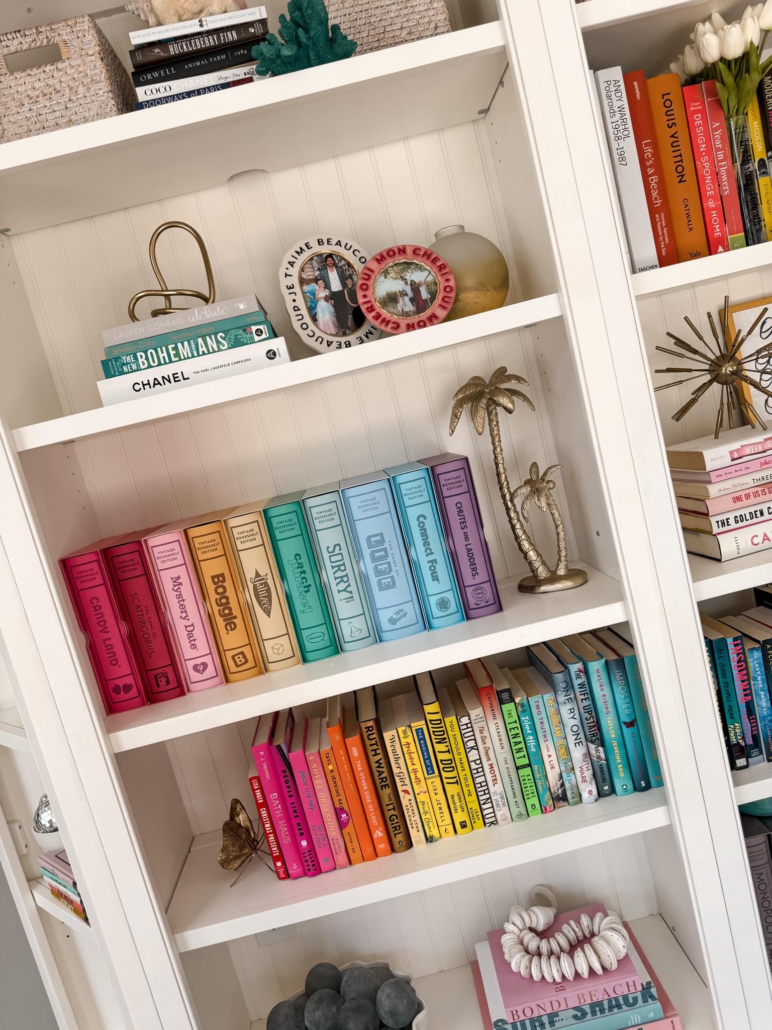 Bookcase shelf display organization 
Rainbow home decor aesthetic 
Pottery barn and vintage bookshelf edition board game collection 