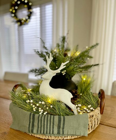 Quick Christmas tray arrangement for your table. All of this is from Target - I painted the deer with white chalk paint to give it rough texture, placed the garland in a circle, and added twinkling lights. It looks SO beautiful at night!!  Christmas, Christmas garland, Christmas home decor, kitchen decor, dining decor, Christmas wreath, Christmas lights

#LTKstyletip #LTKhome #LTKHoliday