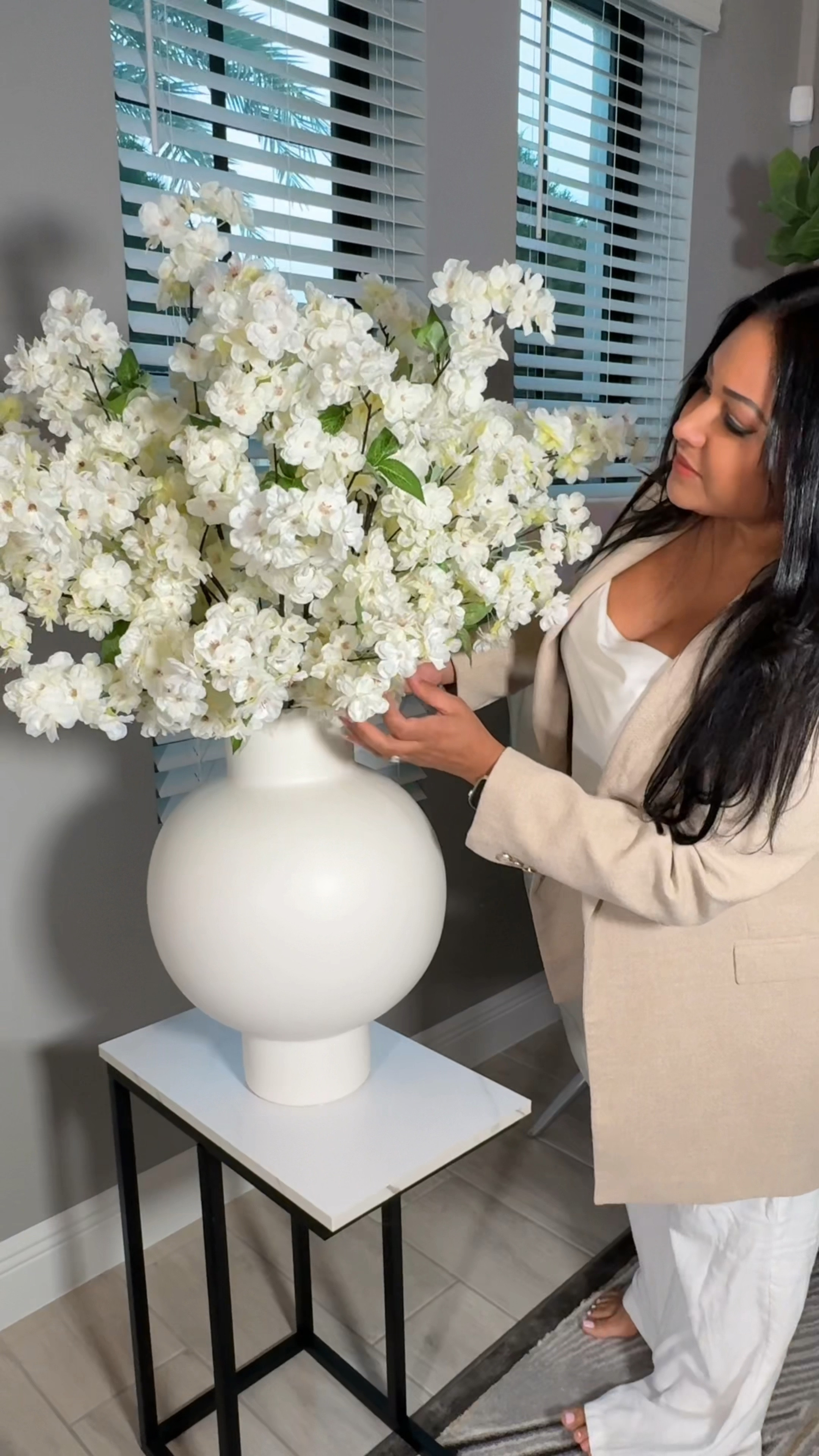 Loving the white cherry blossoms in a white vase very simple and modern decorr

#LTKWatchNow #LTKHome #LTKSeasonal