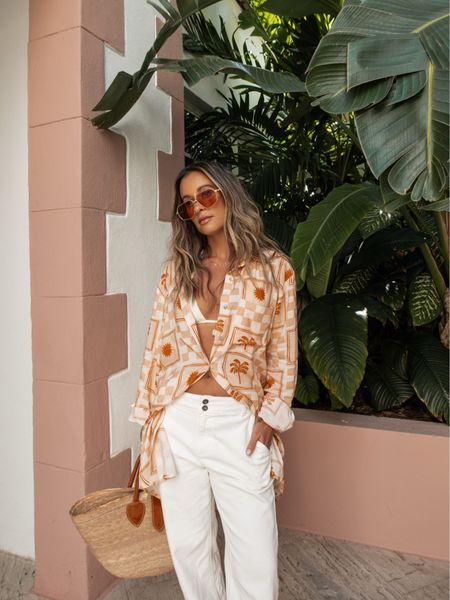 The shirt is Charleston’s own Citrine Hampton Shirt🌞paired w/ the Coastal Seashell Crochet Top from Vici swim collection | Saige Wide Leg Crop in white from Bella Dahl | Dolce Vita’s Dasa Sandals *only* $90 | Color : Warm Natural Raffia + available in several fun summer colors. *Bonus oversized bamboo buckle* • Charlotte Tilbury Collagen Lip Bath Gloss | $35 | Color : Pillow Talk - nude pink. Provides high shine + creates fuller-looking lips. • NYX Slim Lip Pencil Creamy Long Lasting Lip Liner | $5 | Color : Nude Pink • Saltair Nourishing Body Oil made from plants & leaves skin dewy + glowing | 22 | • Juliette Has a Gun - Not a Perfume the scent is so fresh & clean. • Set & Stones stack is the Elliatt Lariat Necklace (14k gold & freshwater Biwa Pearls) | Meri Necklace + a Set & Stones personalized necklace! ✨Are we feeling the Miami Vice vibe? Let me know in the comments! -xx Rachael #StyleTips #StyleGuide #Citrine #Swimwear #VacationOutfit #BeachGirl 

#LTKtravel #LTKbeauty #LTKstyletip