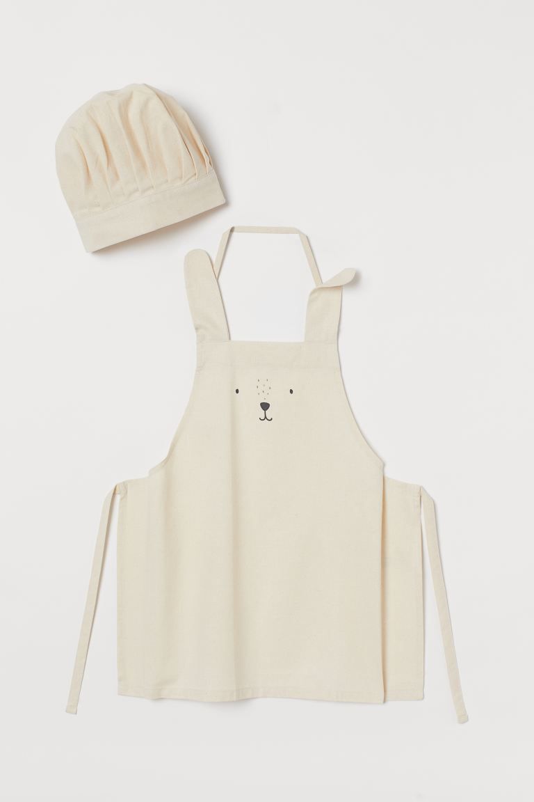 Set with an apron and chef’s hat in woven cotton fabric, designed for children. Apron with ear-... | H&M (US + CA)