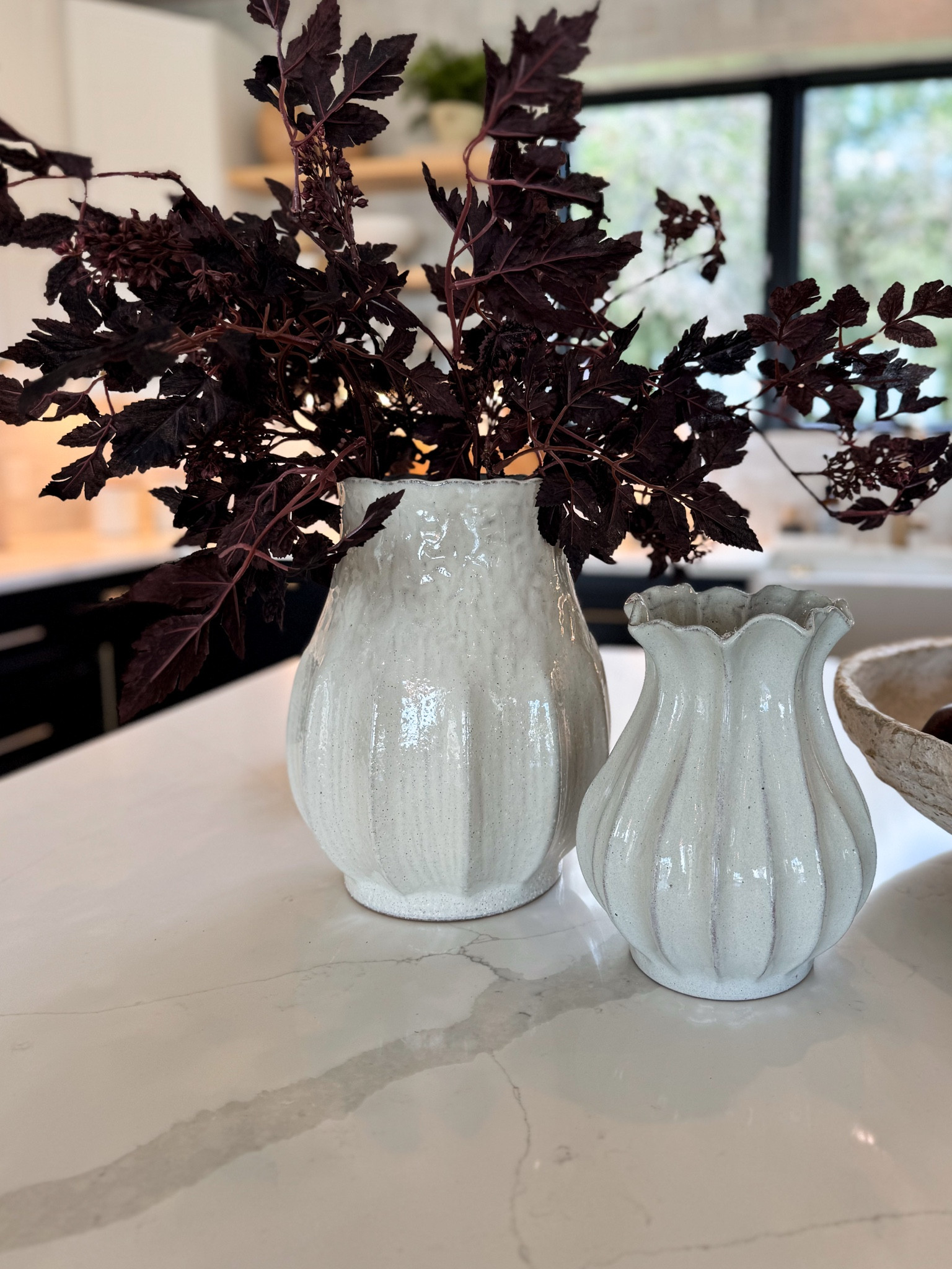 These sculptural white vases from Target have the prettiest shape and texture. I added these deep burgundy stems from Amazon for a bold contrast, and it instantly made the whole space feel ready for fall. Even better, they’re $24 for a pack of 6 stems like I have shown here! Perfect for kitchen islands or console tables. 

#LTKSeasonal #LTKHome #LTKFindsUnder50