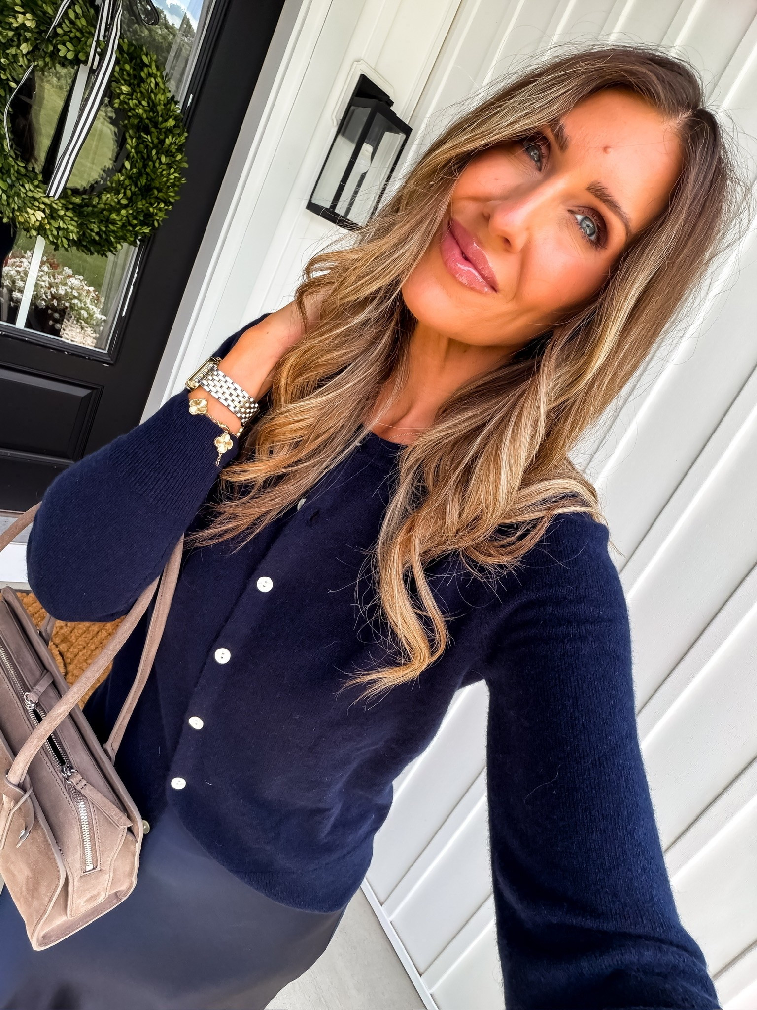A navy cardigan, silky skirt, and neutral accessories is one of those combinations that always feels polished. Perfect for work, dinner, travel days, and everything in between.

Classic style, navy cardigan, satin skirt outfit, elevated basics, chic everyday style, timeless fashion, capsule wardrobe, effortless outfit, neutral accessories, feminine style, everyday elegance, TheMomInStyle

#LTKootd #LTKWorkwear #LTKOver40