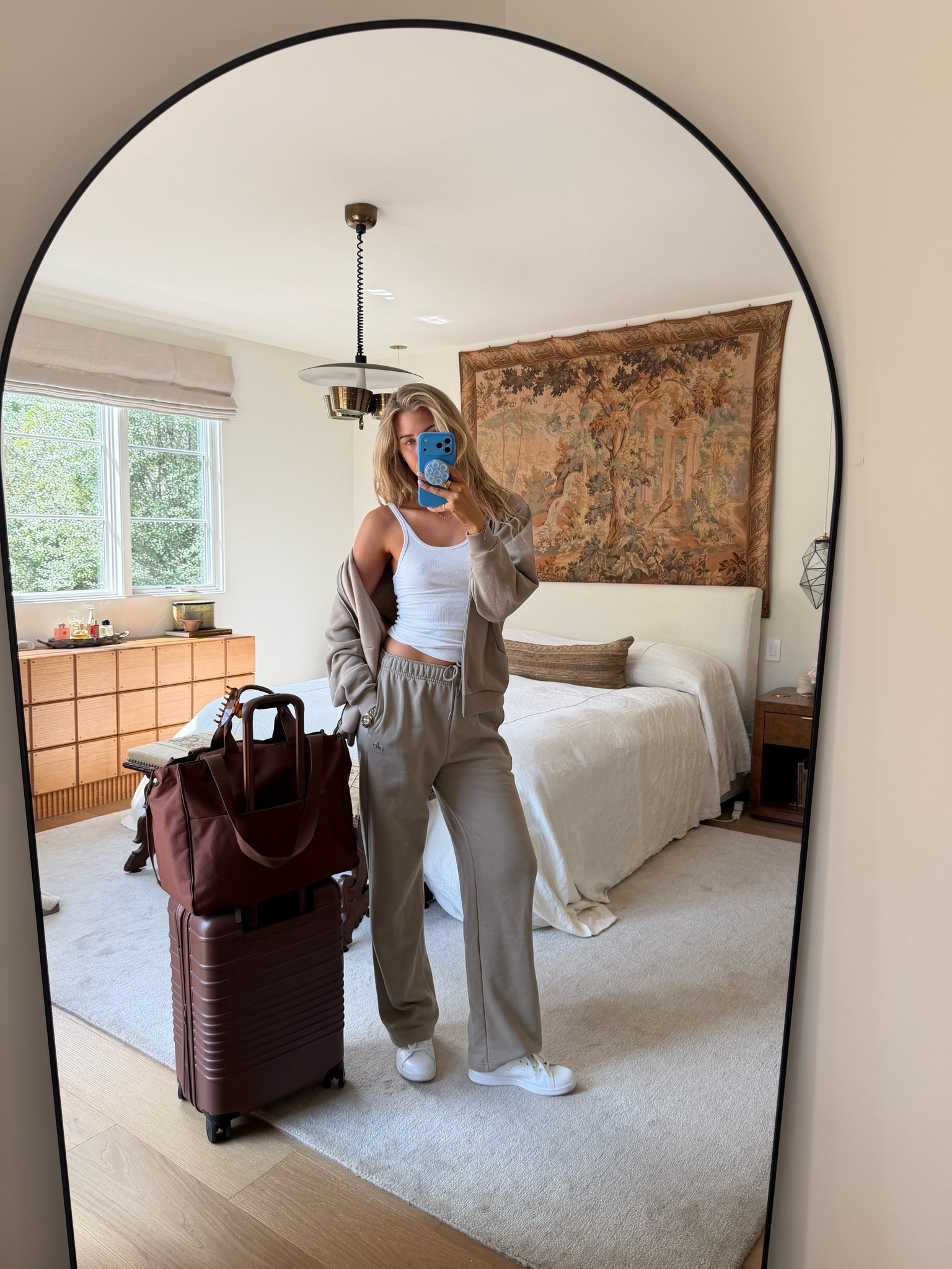 Packed up and ready to go! Here’s my travel outfit — comfy sweats from @Alo Yoga, a ribbed tank top, @adidas sneakers, and my favorite @beistravel  luggage! Size down in the tank :)

#LTKTravel #LTKootd #LTKgrwm