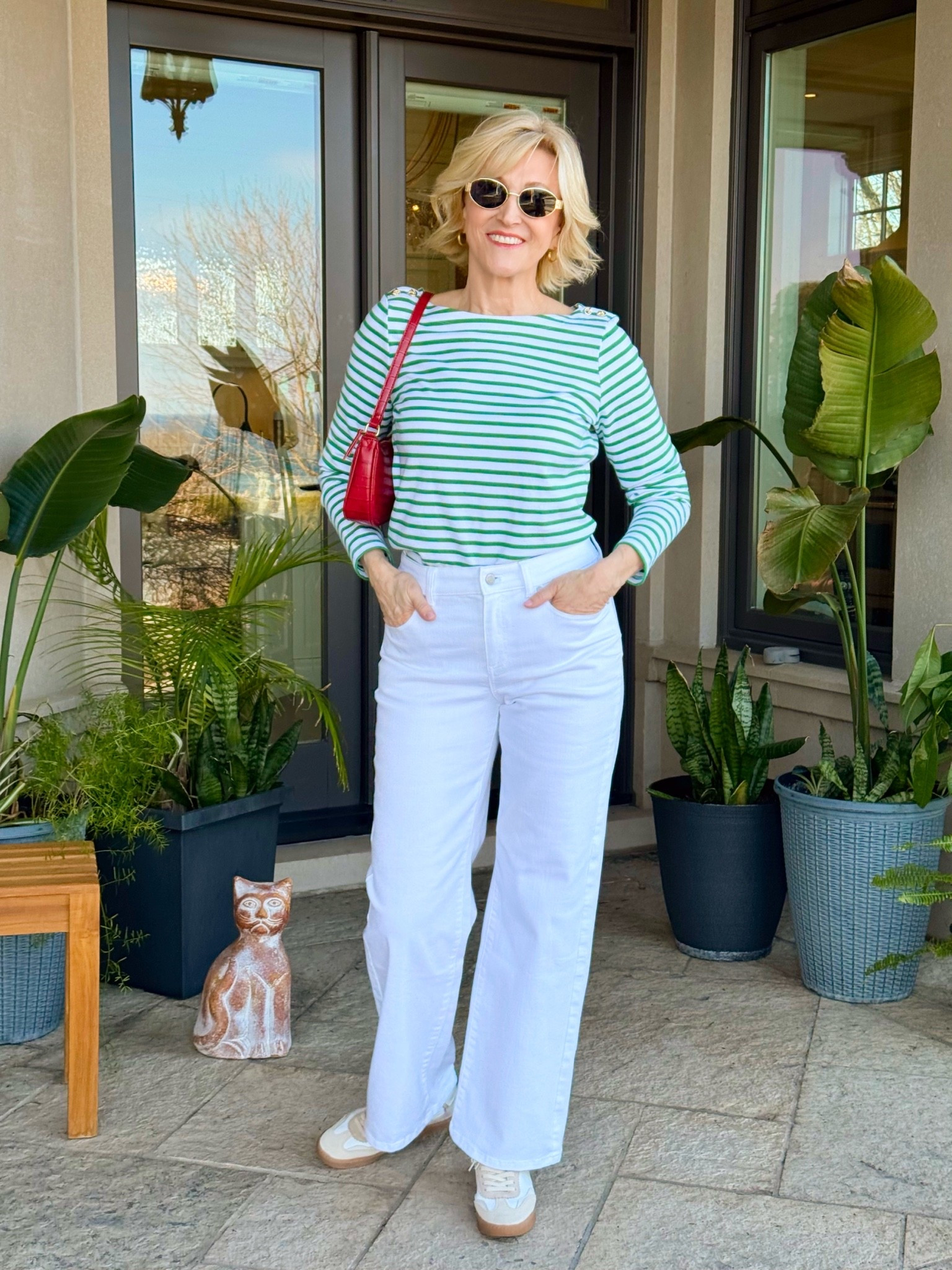A green striped shirt, white wide leg jeans, and retro sneakers… basically my idea of the perfect everyday outfit 💚🤍 I love looks that feel relaxed and comfortable but still look pulled together, and this one checked every box. Easy to wear, easy to style, and definitely one I’ll be repeating ✨

#LTKgrwm #LTKSeasonal #LTKOver40