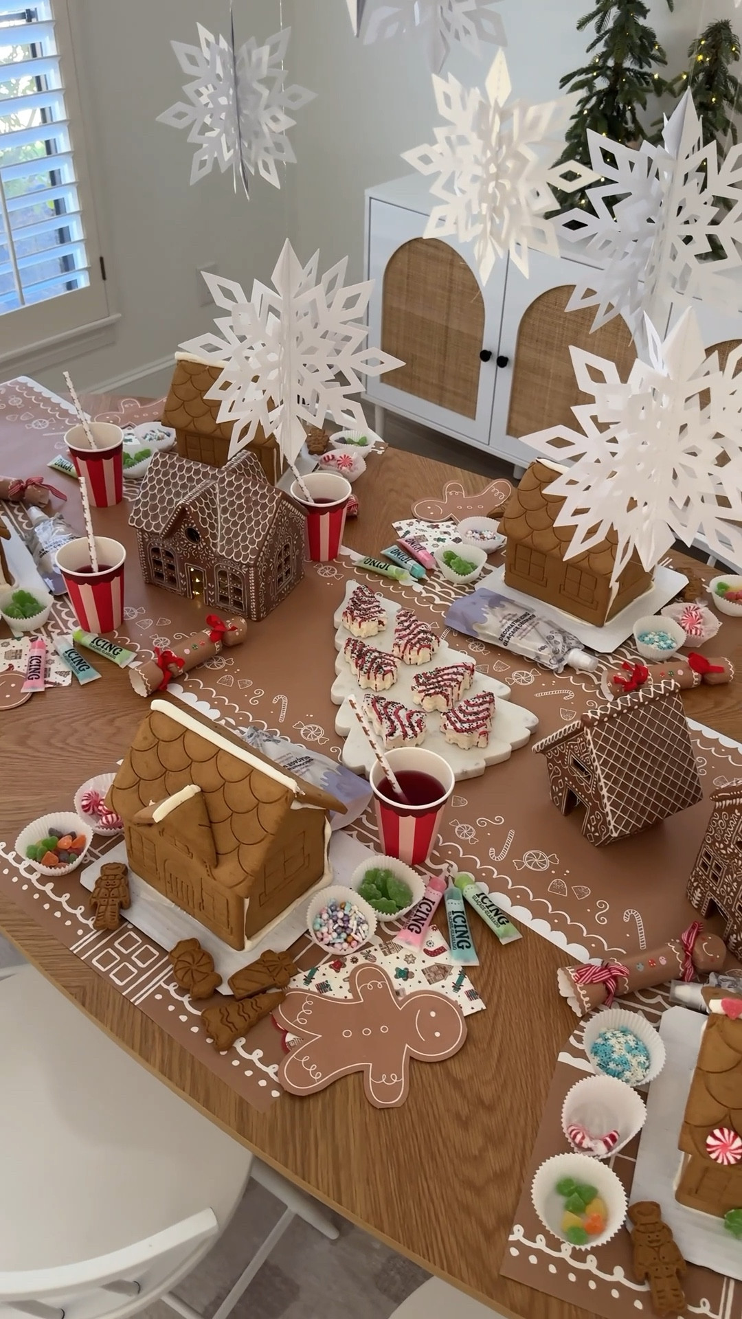 Host a Gingerbread House Decorating Party this holiday.  It’s my favorite family tradition! Hang snowflakes from the ceiling or a light fixture, use pre-built houses for ease & have lots of candy and icing for decorating.  

The paper goods are My Minds Eye. Use my code to save Kristen10

#LTKFamily #LTKParties #LTKHoliday
