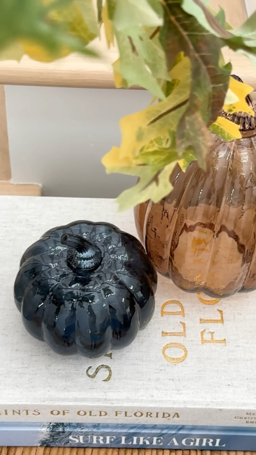 I’m not much of a pumpkin decor girl in the fall, but I love these brown and navy blue glass pumpkins so much! They’re perfect in our fall entryway that also includes a blue linen console table, faux oak leaves, and a seagrass table lamp.
.
#ltkhome #ltkfindsunder50 #ltkseasonal #ltkstyletip #ltksalealert #ltkfindsunder100

#LTKVideo #LTKHome #LTKSeasonal