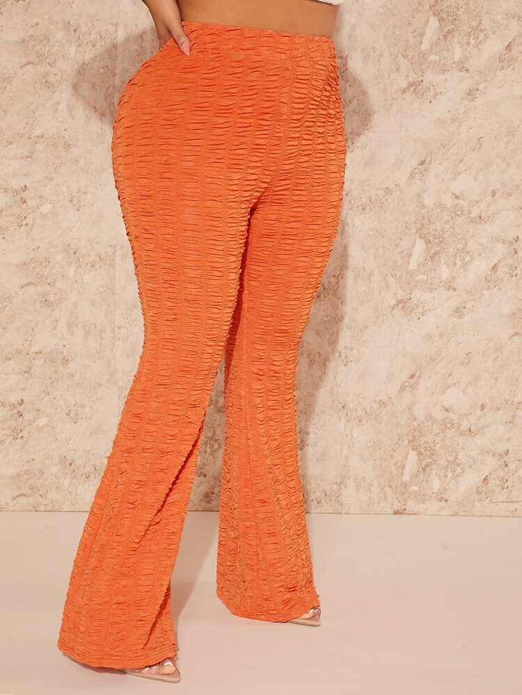 SHEIN SXY Plus Solid Textured Flare Leg Pants | SHEIN