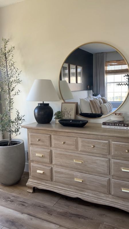 Bedroom dresser styling inspo. The best formula to a perfectly styled dresser: a lamp, a large vase, stacked booked, a trinket dish, a small plant or vase, layered art, a decorative bowl or basket 

#LTKhome #LTKFind
