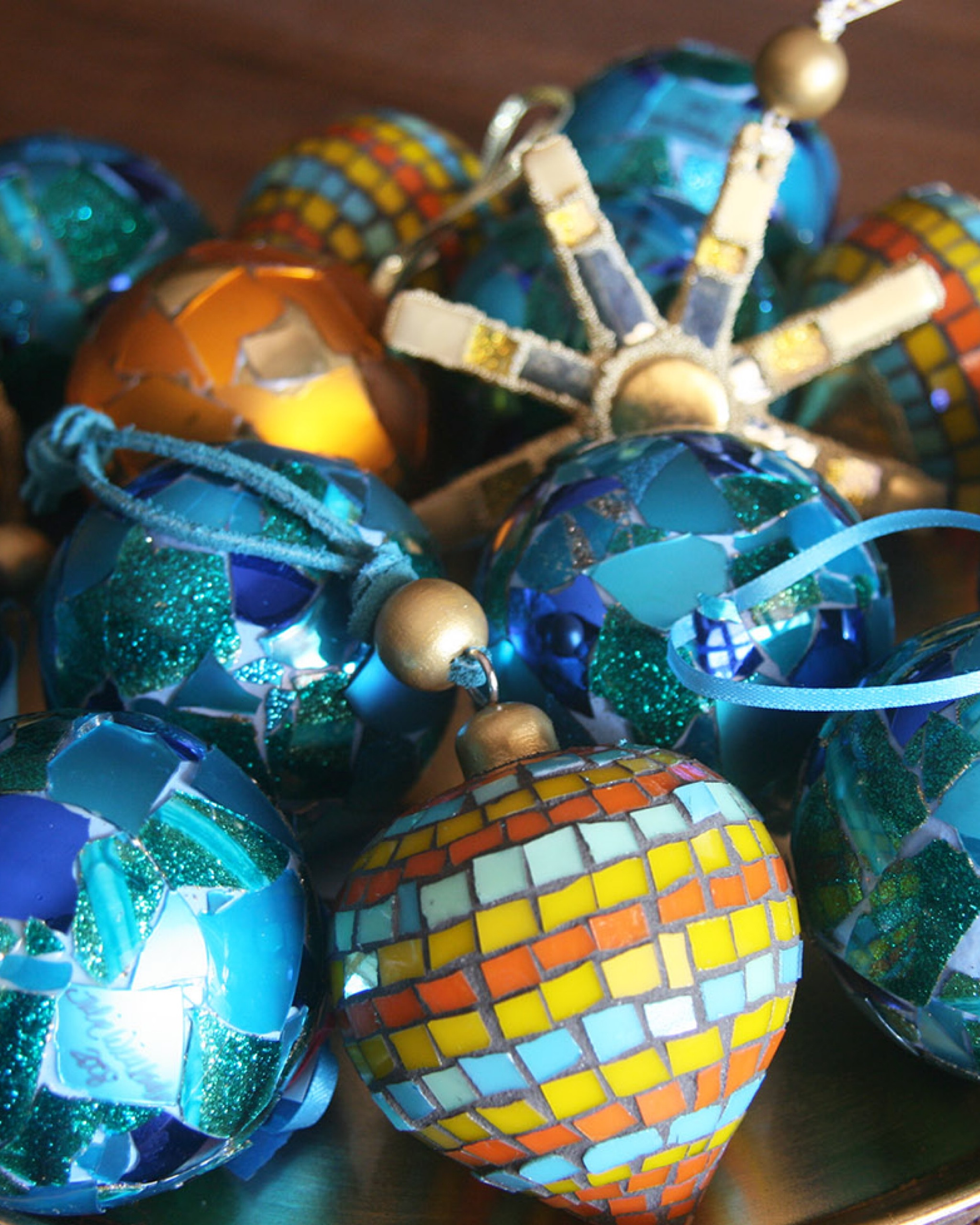 Sharing a tray of handmade glass mosaic ornaments. Grouped together they make quite a fun centerpiece for a coffee table. Each ornament is covered with hand cut glass. 🎄 For mosaic tips, tutorials, inspiration, and so much more please visit my YouTube channel: YouTube.com/julieweilbacher. 🎄 Follow @julieweilbacher on Instagram for all things mosaic art. coffee table decor - glass ornaments - broken glass ornaments - mosaic - round glass ornaments - mosaics - gold tray - gold star ornaments - hostess gift - holiday tablescapee

#LTKhome #LTKHoliday #LTKSeasonal
