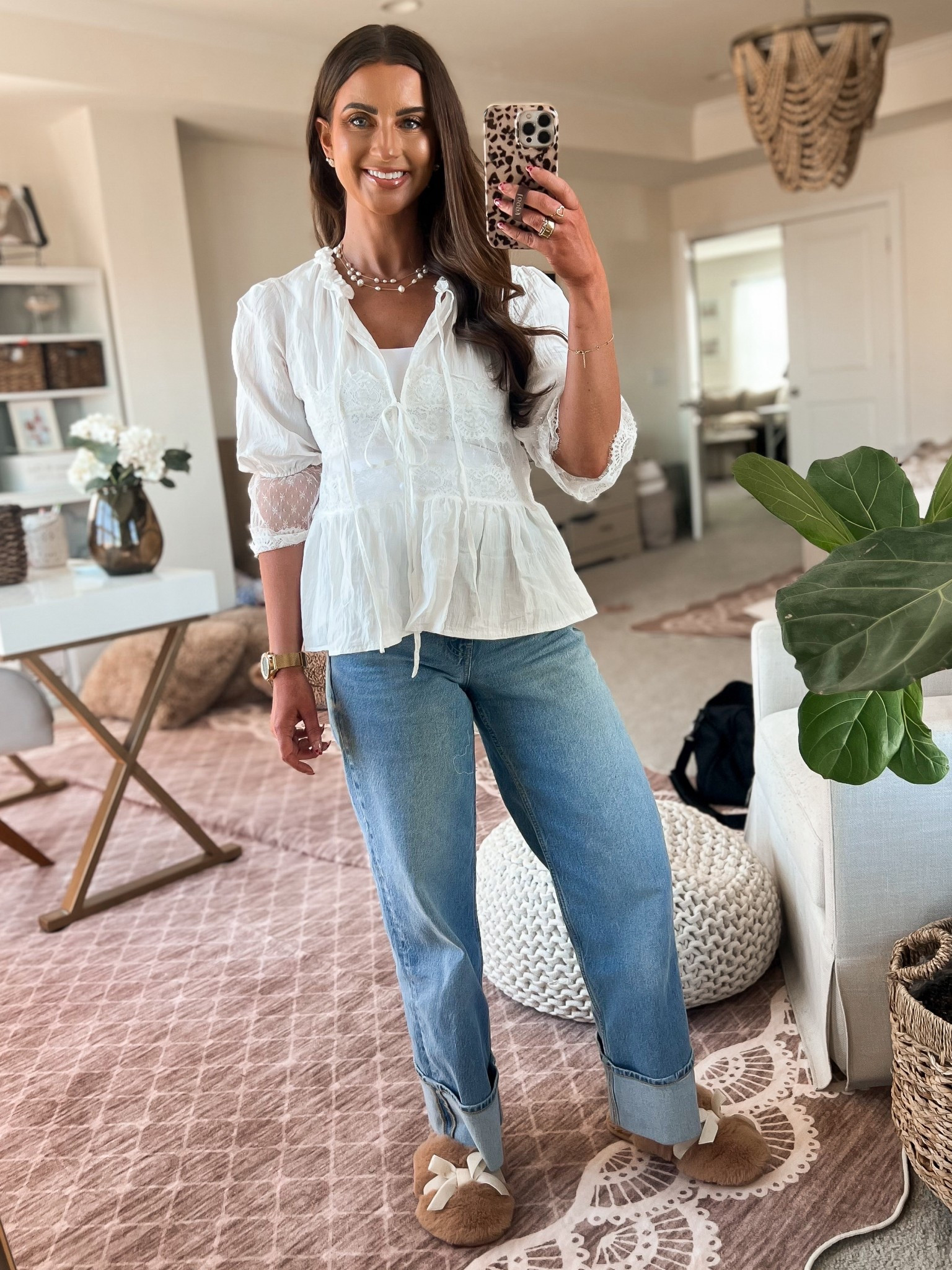 White lace peplum tie front shirt-small 
Gold pearl layered necklace 
High waisted cuffed jeans 
Bow slippers
Gold pedometer watch
Gold round rhinestone earrings
Gold heart rings
Gold Oura ring