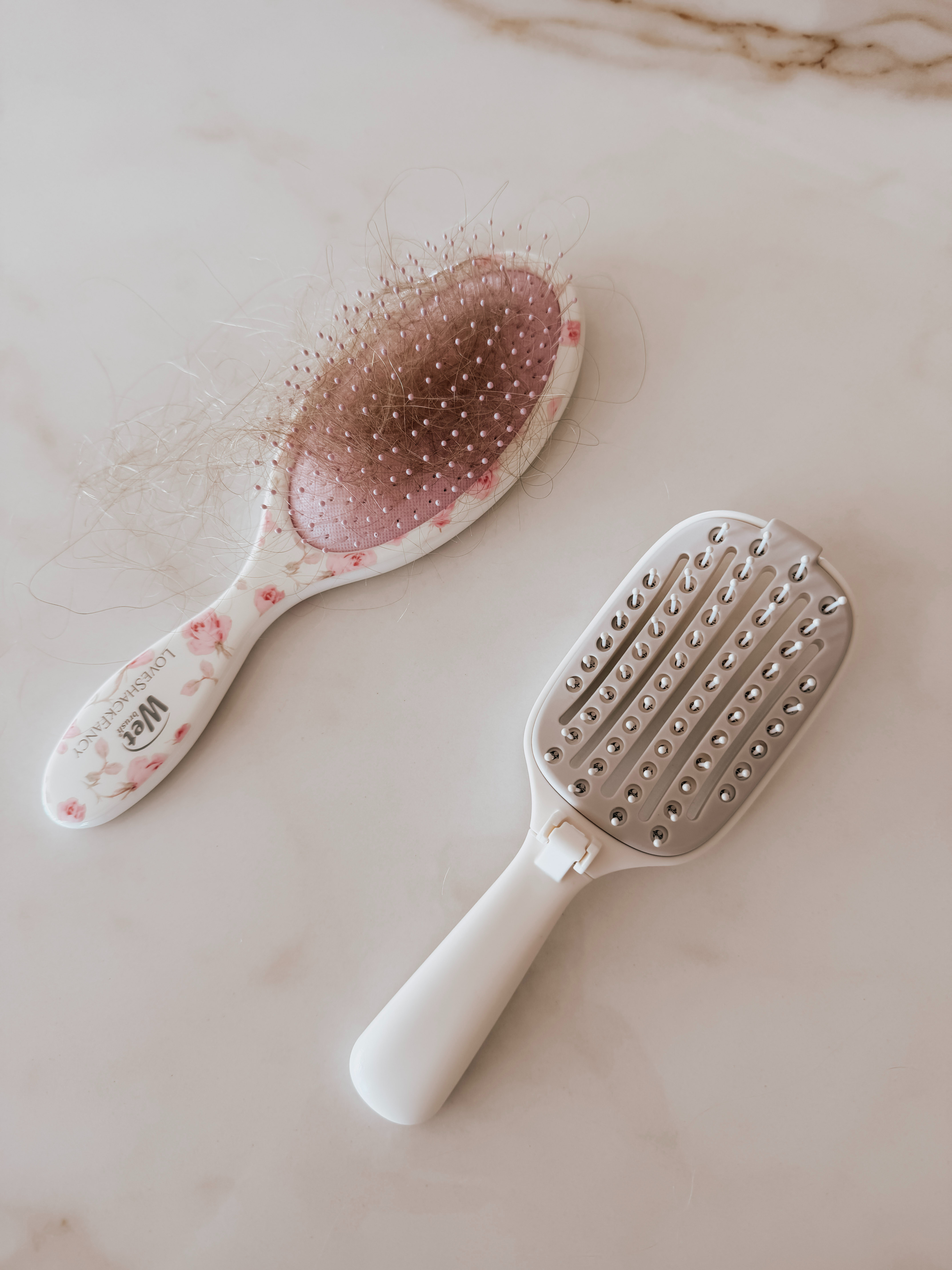 This foldable hair brush is the perfect little beauty essential for your bag. ✨ It works on wet or dry hair, folds down for easy storage, and features a self-cleaning design that makes removing hair from the brush a breeze. Perfect for travel, touch-ups, and keeping in your handbag! 

 #LTKgrwm #LTKmorningroutine #LTKTravel