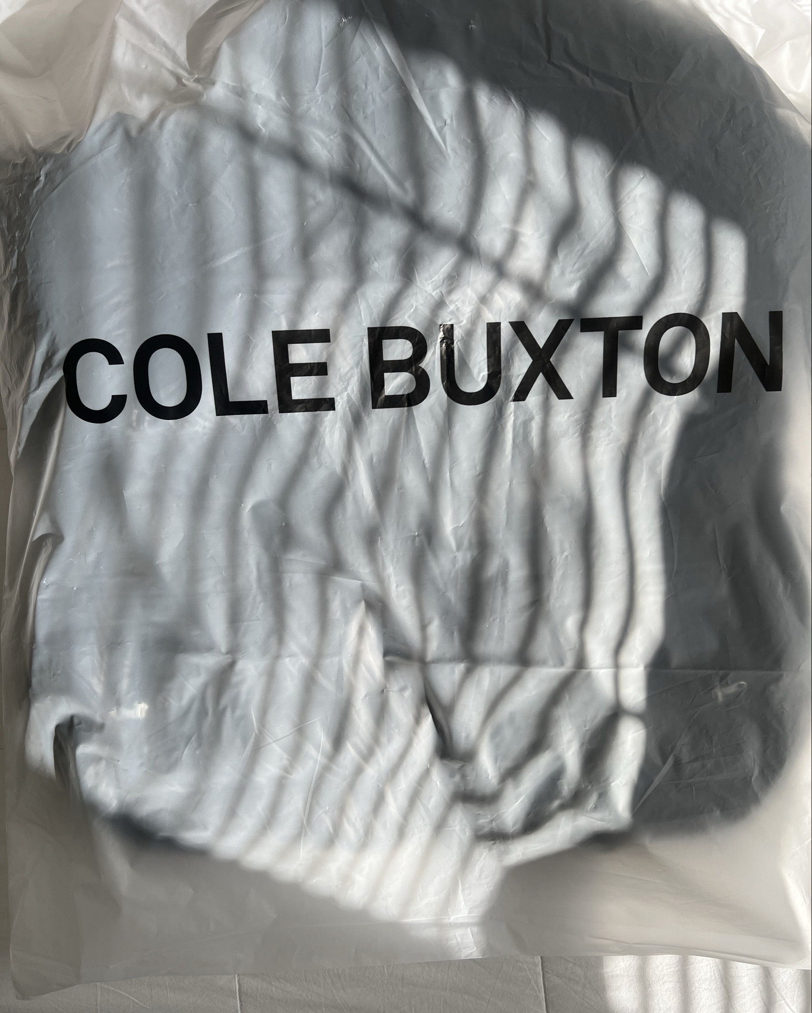 This sleek, high-shine puffer is designed for warmth without bulk, featuring a quilted down-filled construction and a cozy hood for extra protection against the elements. The minimalist aesthetic, signature to Cole Buxton, ensures versatility—whether you’re layering it over casual streetwear or dressing up a winter fit. 

#LTKStyleTip #LTKWorkwear