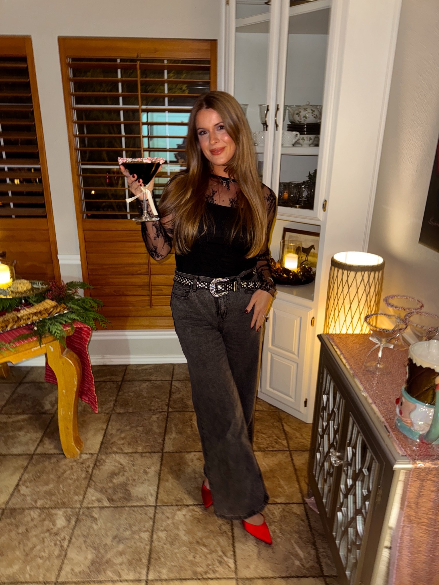 Black holiday outfit! I love these jeans so much and how fun are these red heels! 👠 

#LTKSeasonal #LTKmomlife #LTKootd