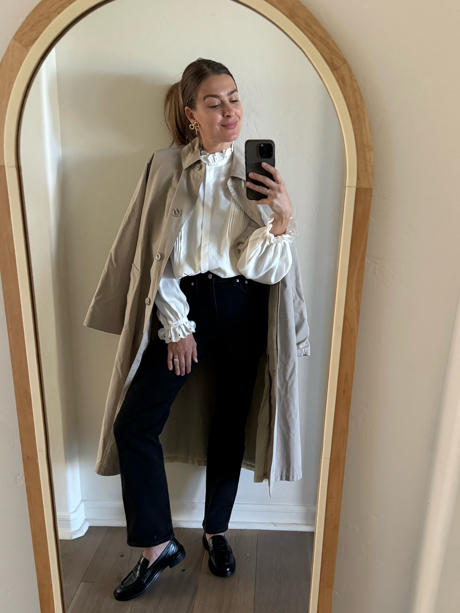 The classic black and white look. Dressy top with straight black denim, a pair of loafers. Vintage trench coat. The gold statement earrings. ✨

#LTKHoliday #LTKstyletip #LTKCyberWeek