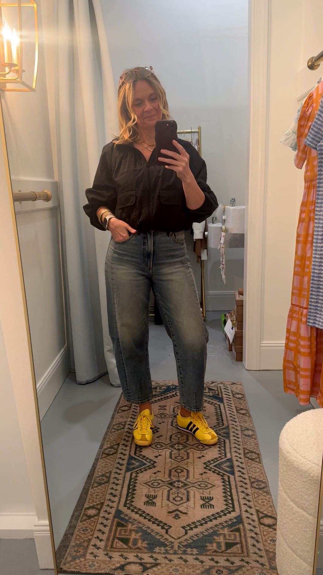 Everyone loves a neutral sneaker because it goes with everything, but a bold colored sneaker is the real secret weapon for making a simple outfit actually memorable 👇

Here’s why it works:

💛 It does the styling work for you. When one piece is doing all the talking, everything else can stay simple. Black windbreaker + straight leg denim + yellow sneakers — the outfit practically styles itself.

💛 It shows personality without overthinking it. A bold shoe is the lowest commitment way to add color and energy to your look. You’re not wearing a bright top or a printed pant — just a great sneaker that says you got dressed on purpose.

💛 It makes basics look intentional. The difference between a forgettable outfit and a memorable one is often just one unexpected detail. A bold sneaker is that detail every single time.

OOTD while setting up a dressing room for a client appointment 🙋‍♀️ Black windbreaker + barrel leg jeans + yellow Adidas — all from my own closet. Linked the exact pieces where I can and the closest versions where I can’t. Everything shoppable below! 👇

#LTKdayinmylife #LTKootd #LTKOver40