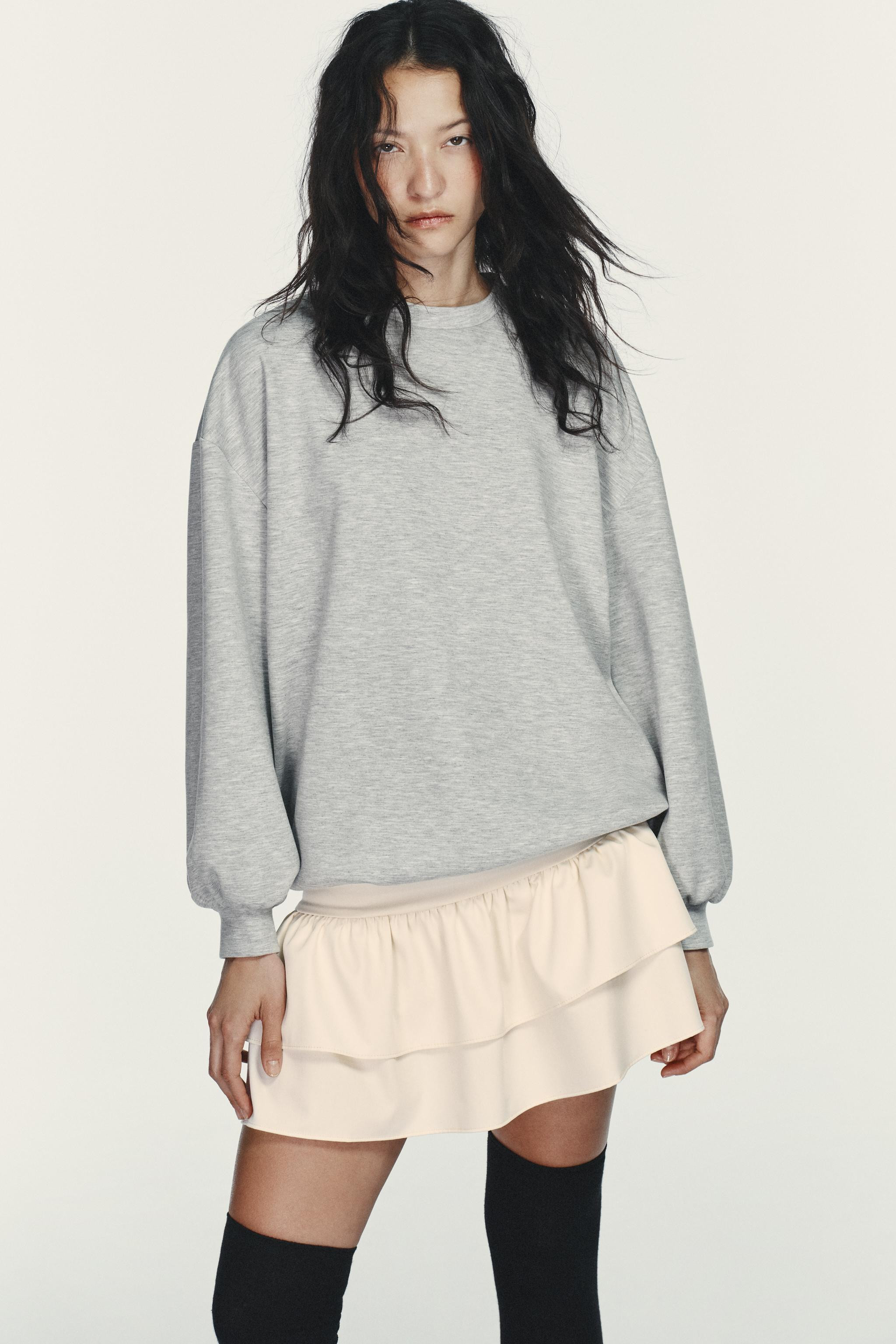 High-neck dress with bow and long sleeves. Semi-sheer combination fabric detail and skirt with ve... | Zara US